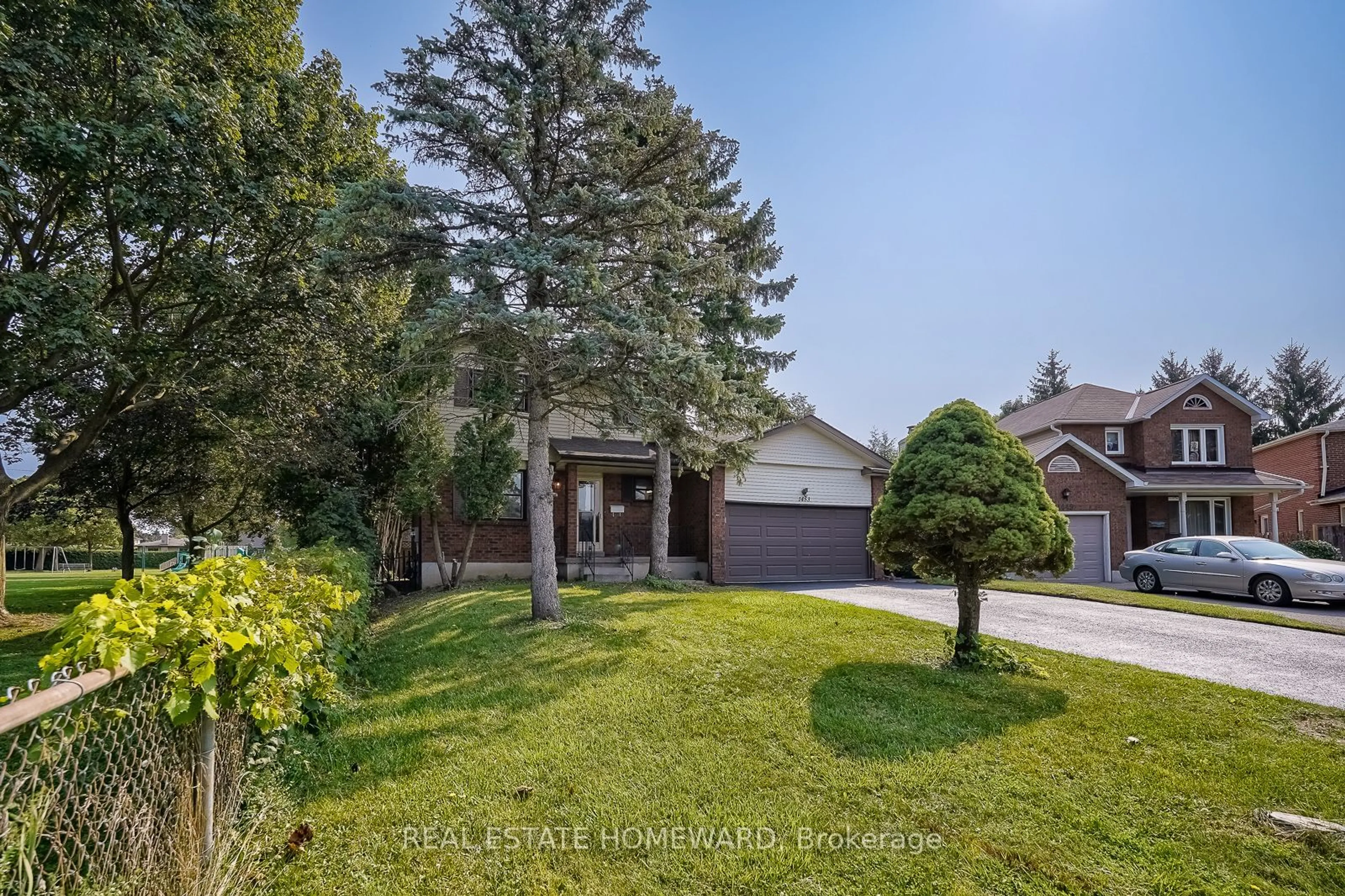 Frontside or backside of a home, the fenced backyard for 1453 Manitou Crt, Oshawa Ontario L1G 7P8