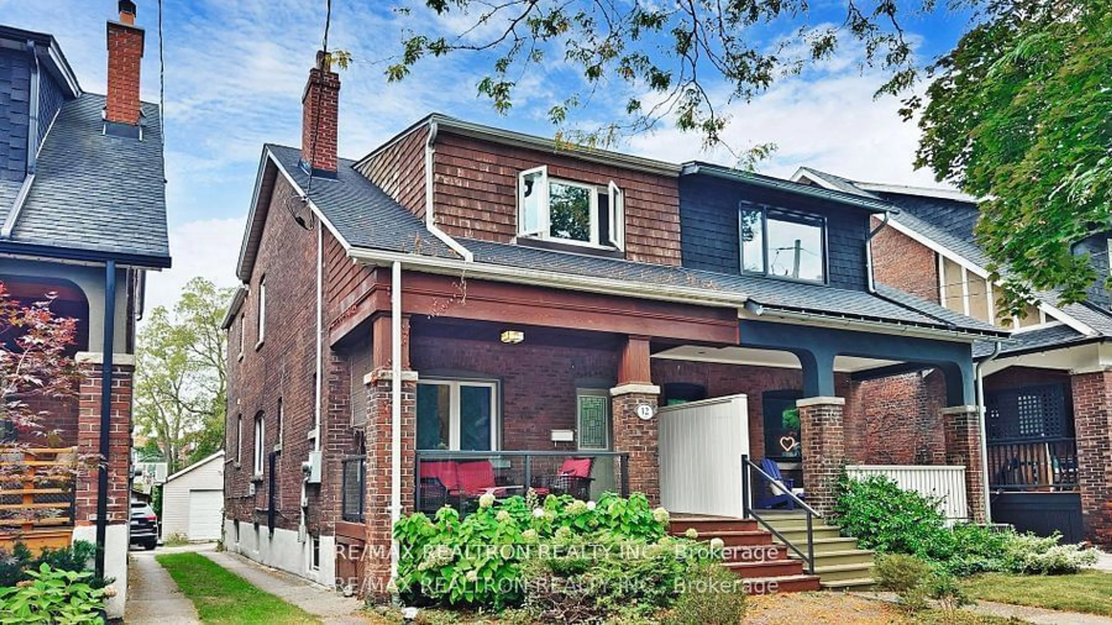 Home with brick exterior material for 12 Lark St, Toronto Ontario M4L 3M6