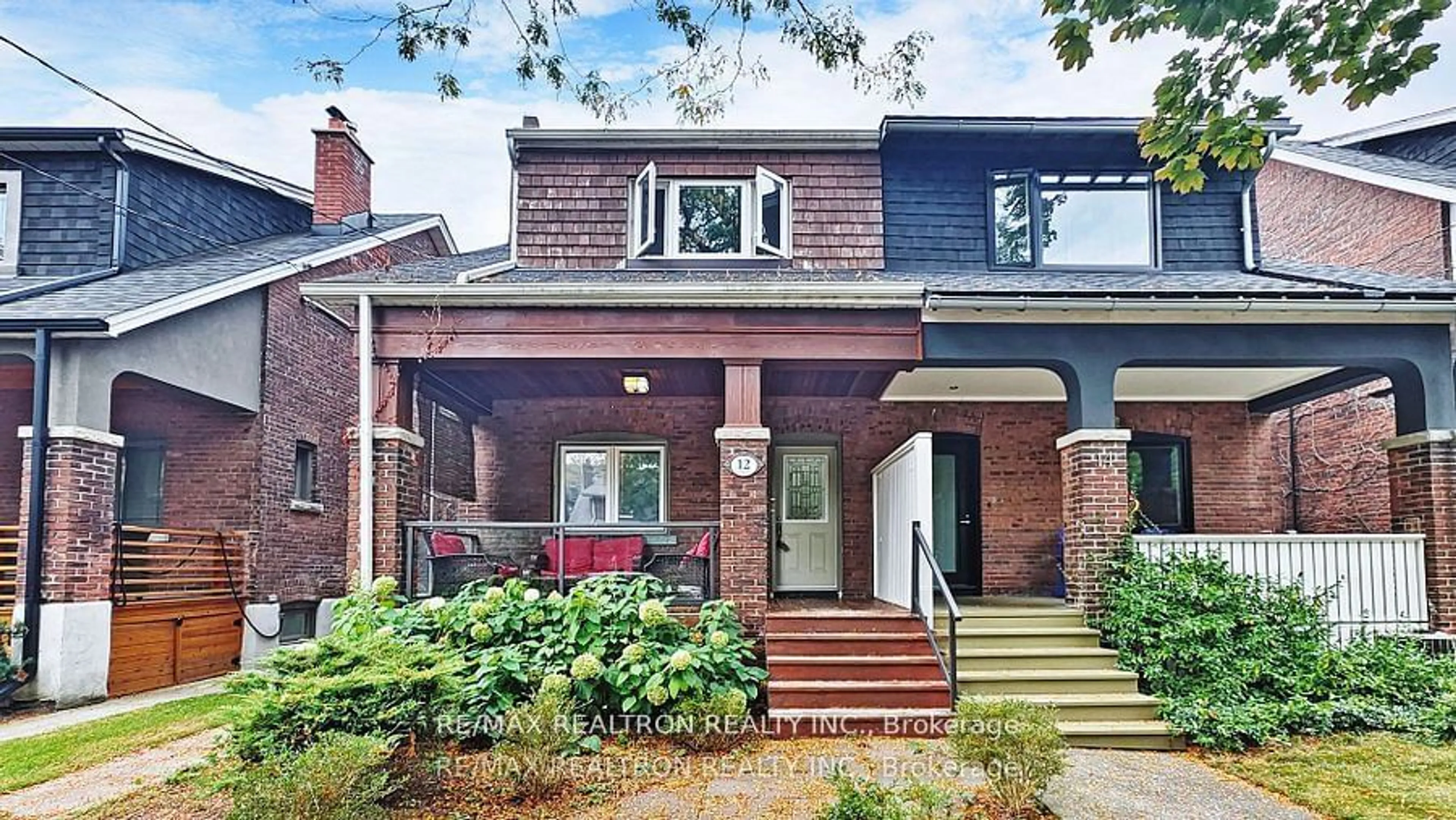 Home with brick exterior material for 12 Lark St, Toronto Ontario M4L 3M6