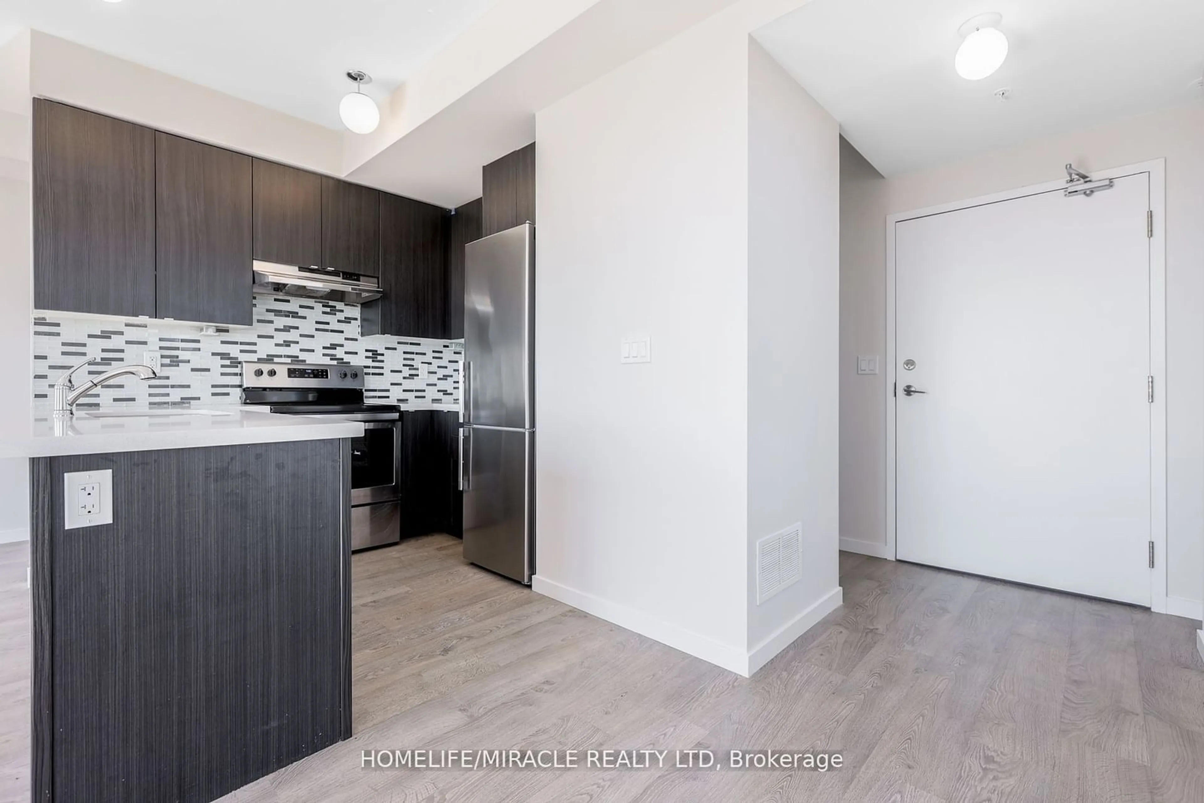 Standard kitchen, wood floors for 1711 Pure Springs Blvd #419, Pickering Ontario L1X 0E3