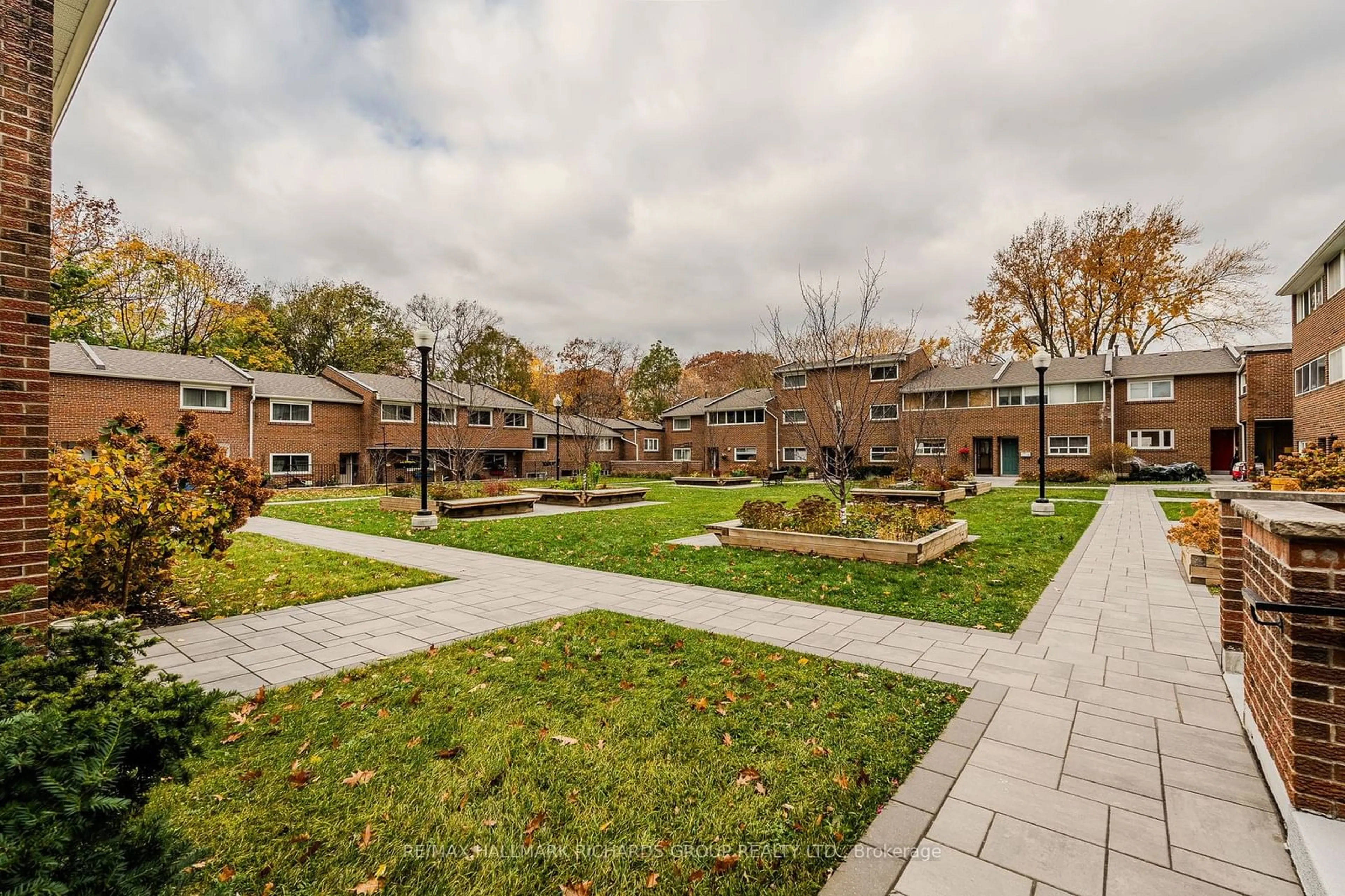 Patio, the fenced backyard for 90 Edgewood Ave #107, Toronto Ontario M4L 3H1