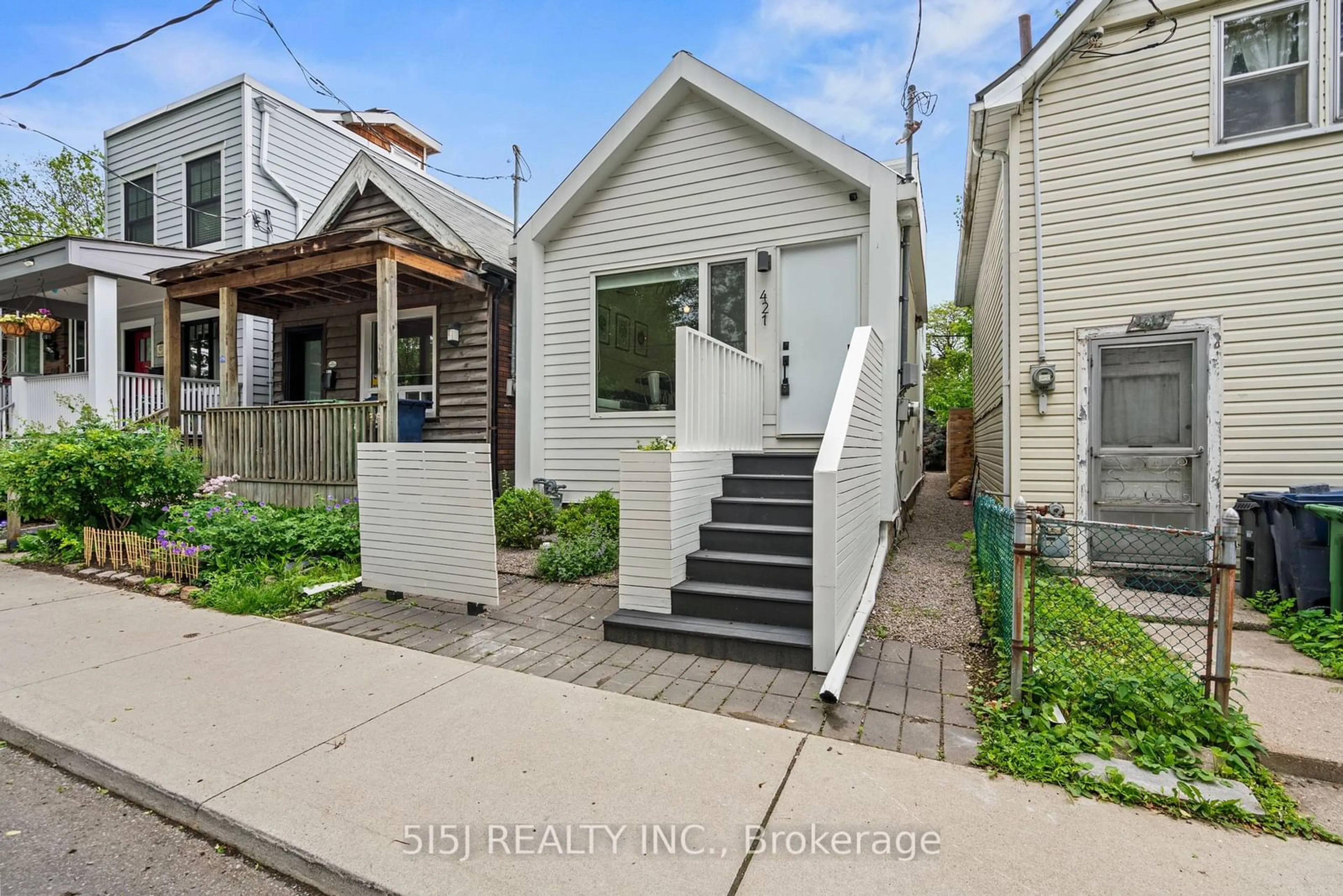 Frontside or backside of a home, the street view for 421 Craven Rd, Toronto Ontario M4L 2Z5