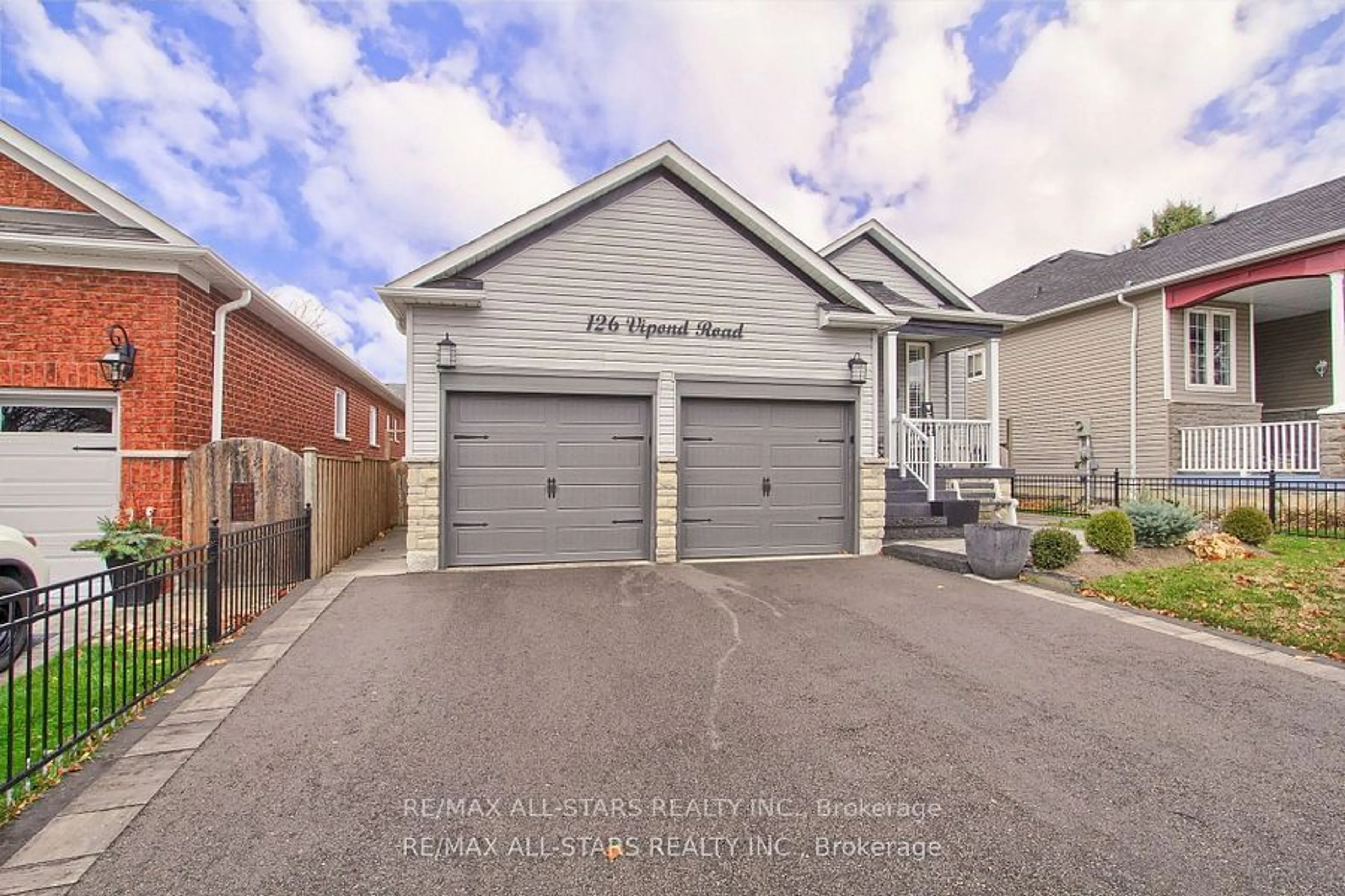 Frontside or backside of a home, the street view for 126 Vipond Rd, Whitby Ontario L1M 1K9