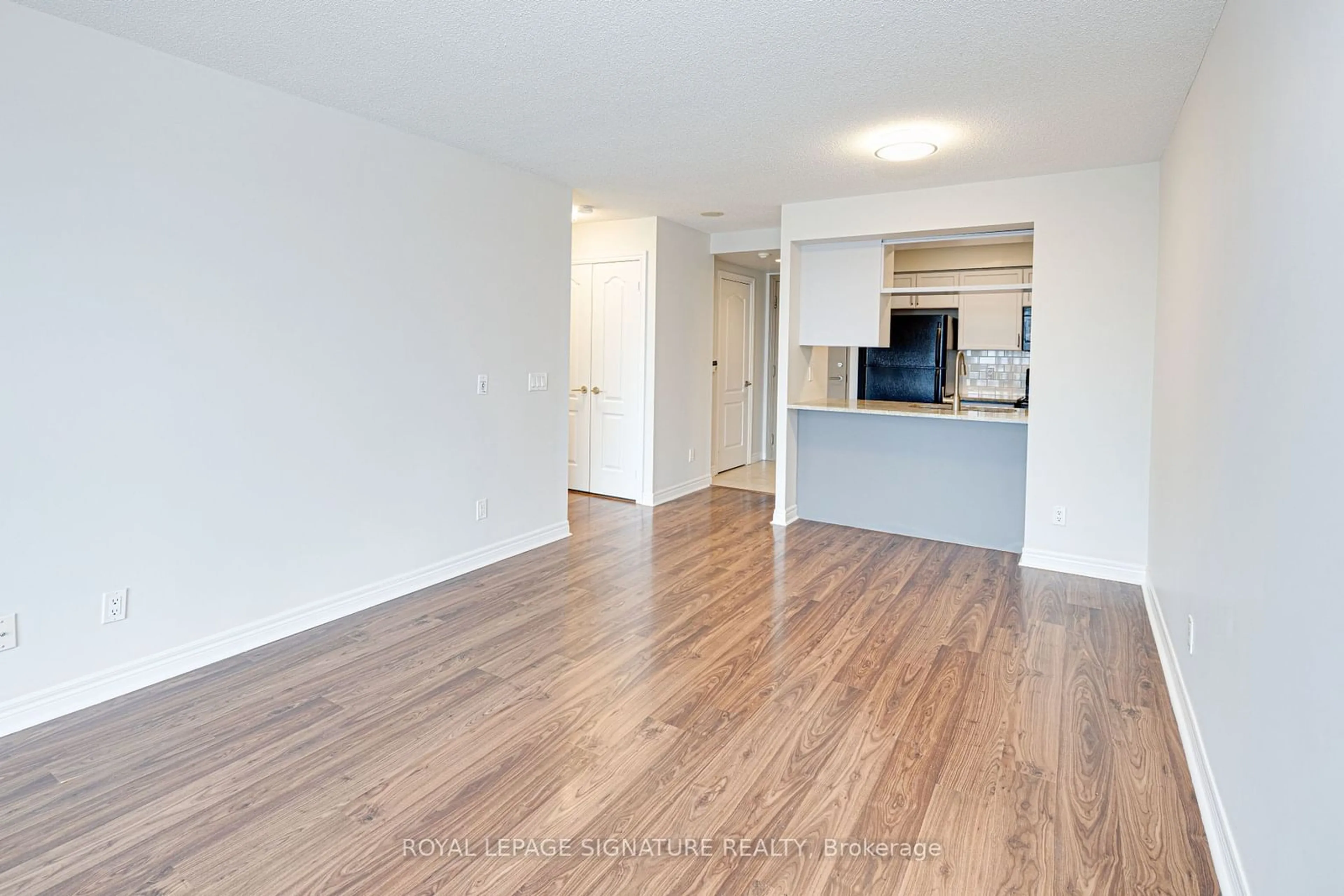 A pic of a room, wood floors for 70 Town Centre Crt #1803, Toronto Ontario M1P 0B2