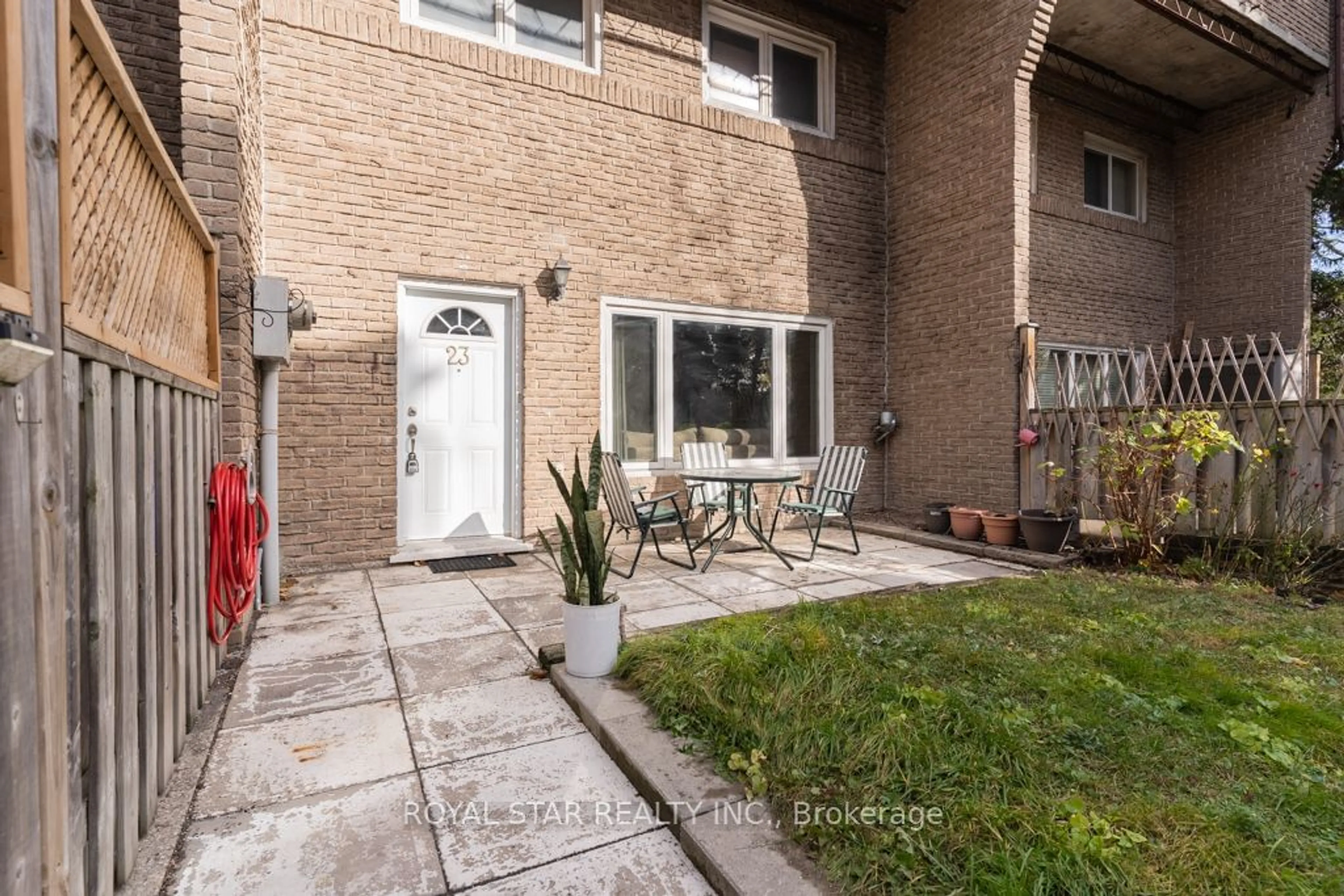 A pic from exterior of the house or condo, the fenced backyard for 91 Muir Dr #23, Toronto Ontario M1M 3T7