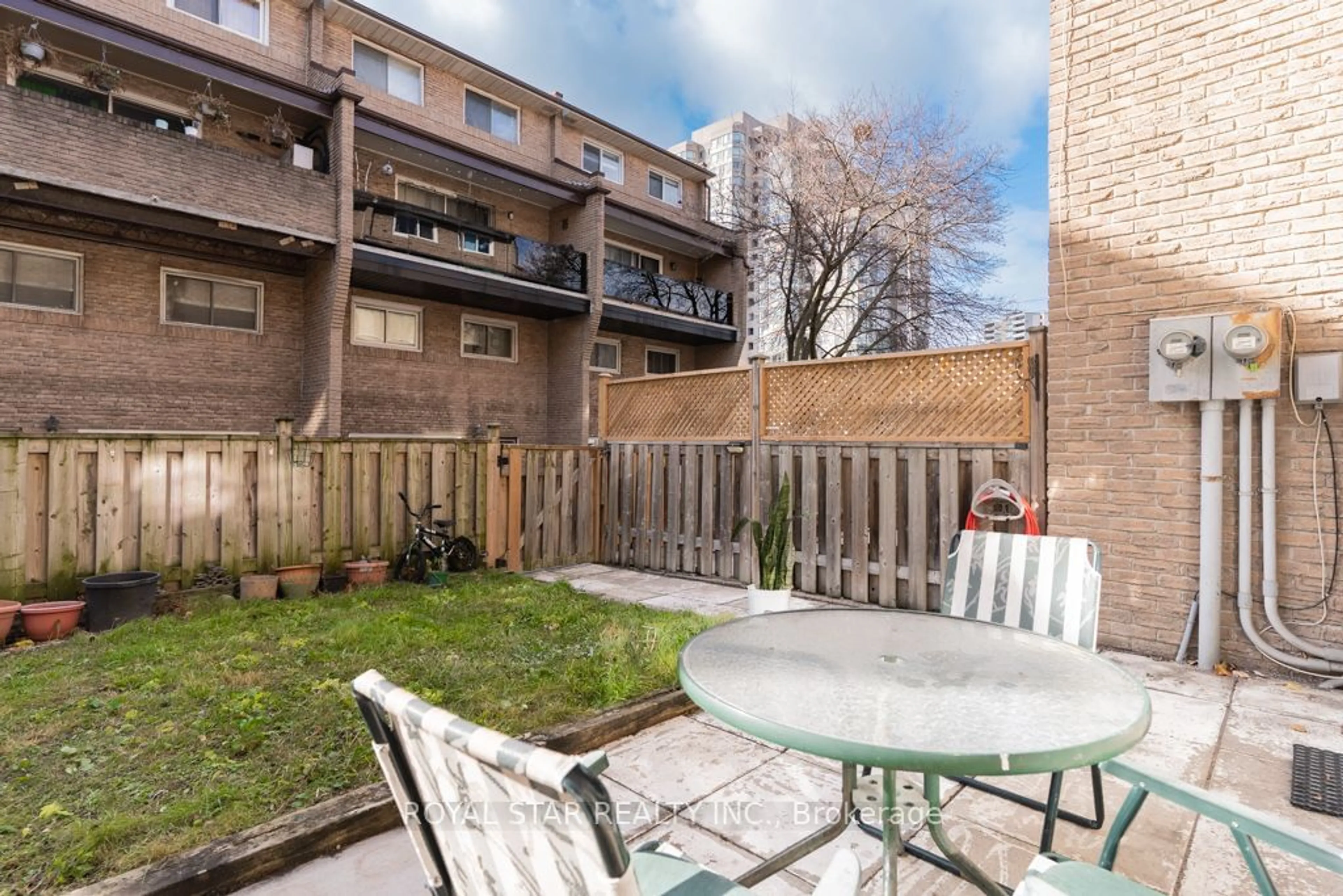 Patio, the fenced backyard for 91 Muir Dr #23, Toronto Ontario M1M 3T7