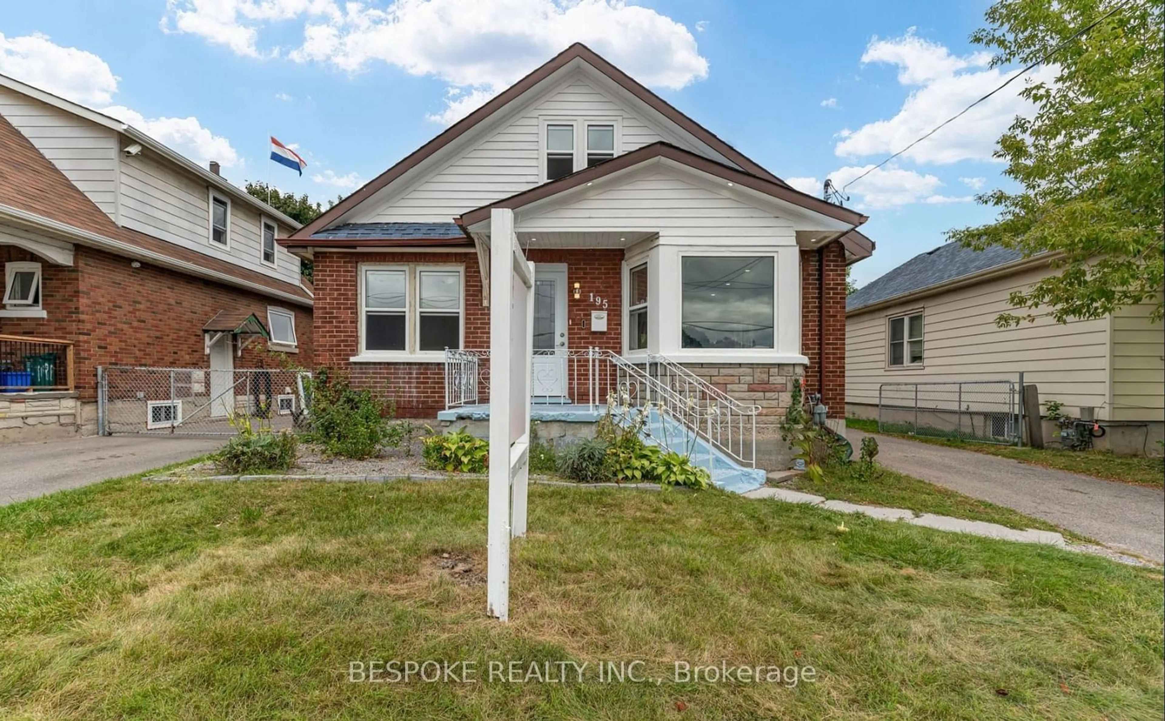 Frontside or backside of a home, the fenced backyard for 195 Park Rd, Oshawa Ontario L1J 4H1