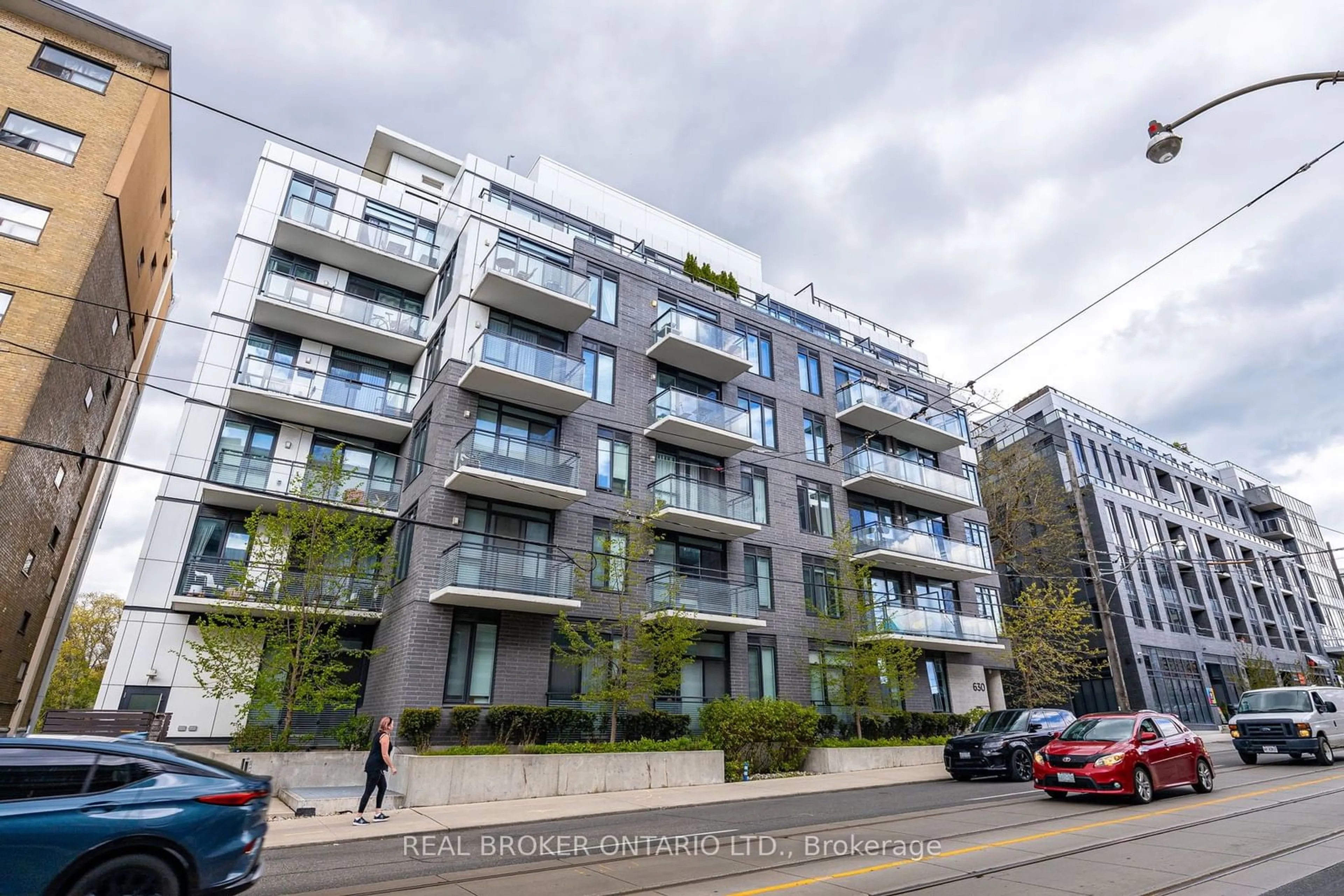 A pic from exterior of the house or condo, the street view for 630 Kingston Rd #609, Toronto Ontario M4E 0B7