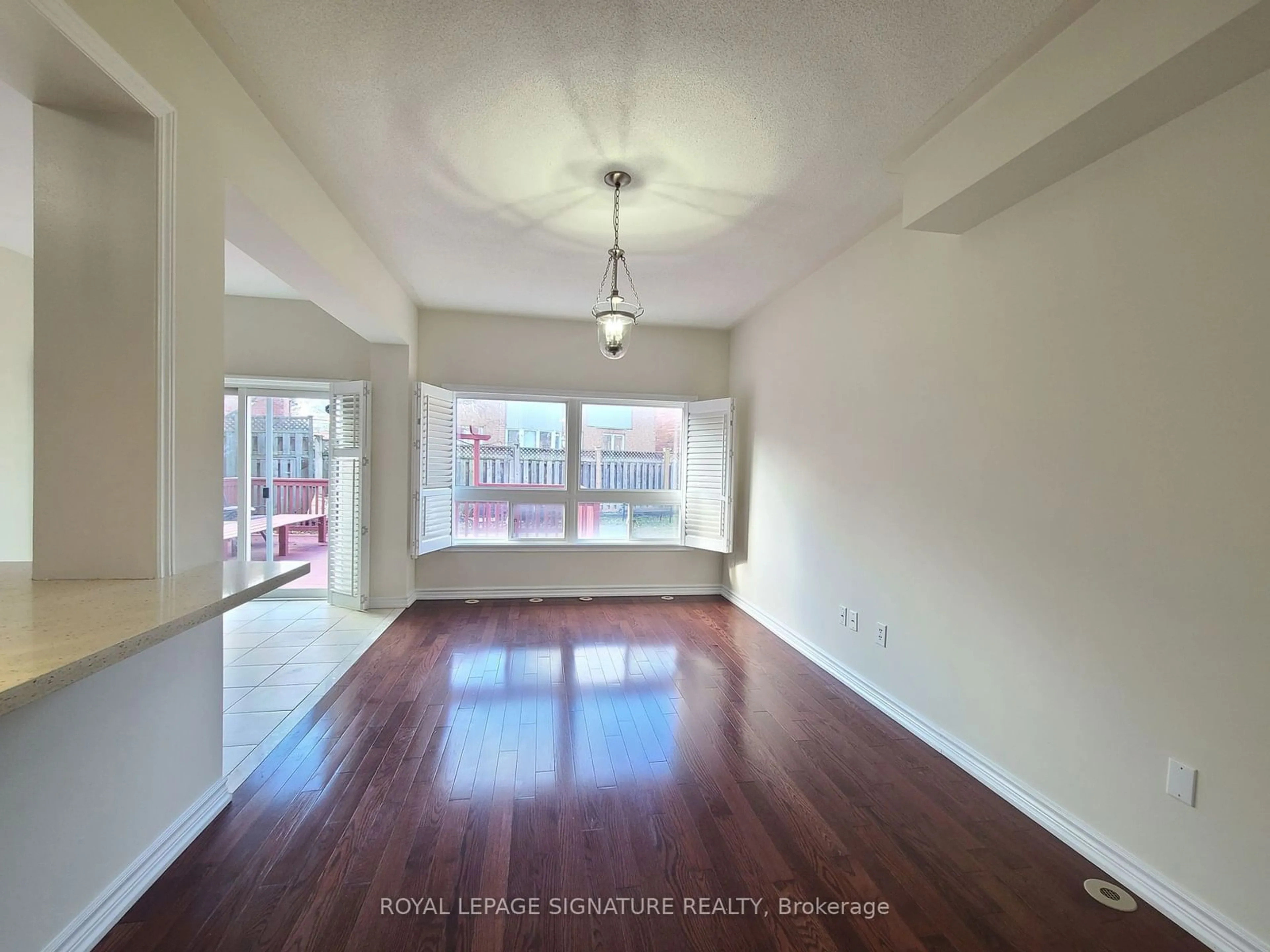 A pic of a room, wood floors for 54 Wyper Sq, Toronto Ontario M1S 0B3