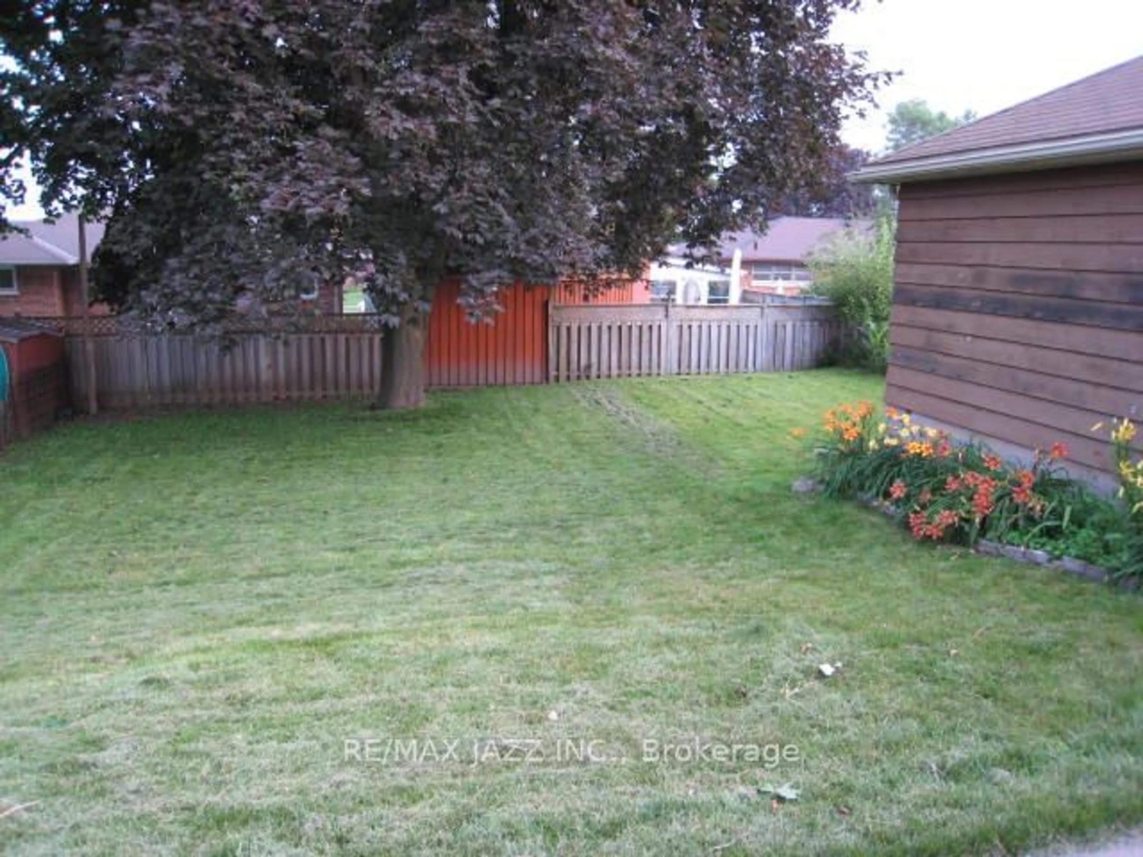 Frontside or backside of a home, the fenced backyard for 759 Tennyson Ave, Oshawa Ontario L1H 3K5