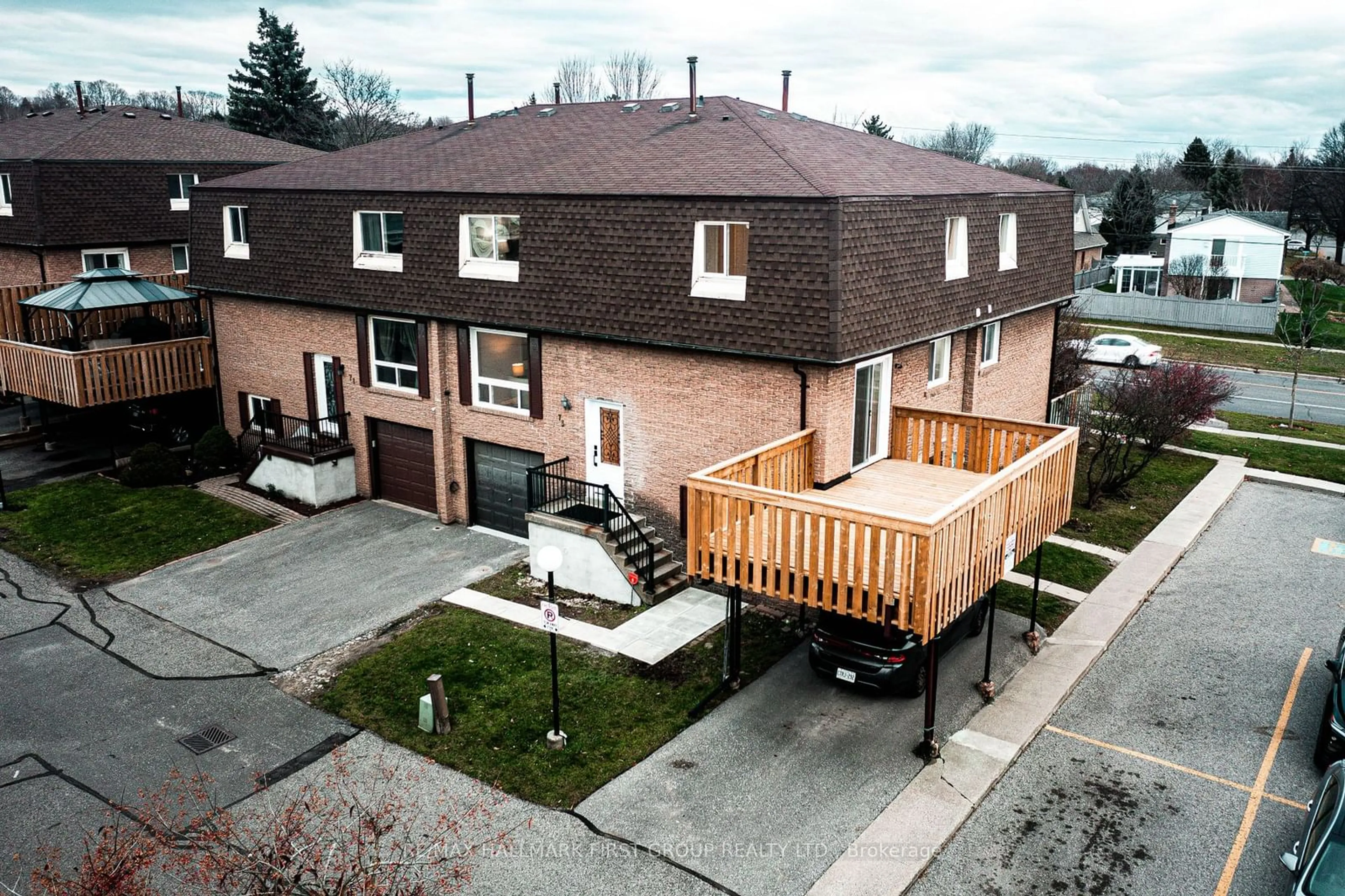 A pic from exterior of the house or condo, the fenced backyard for 966 Adelaide Ave #73, Oshawa Ontario L1K 1L2