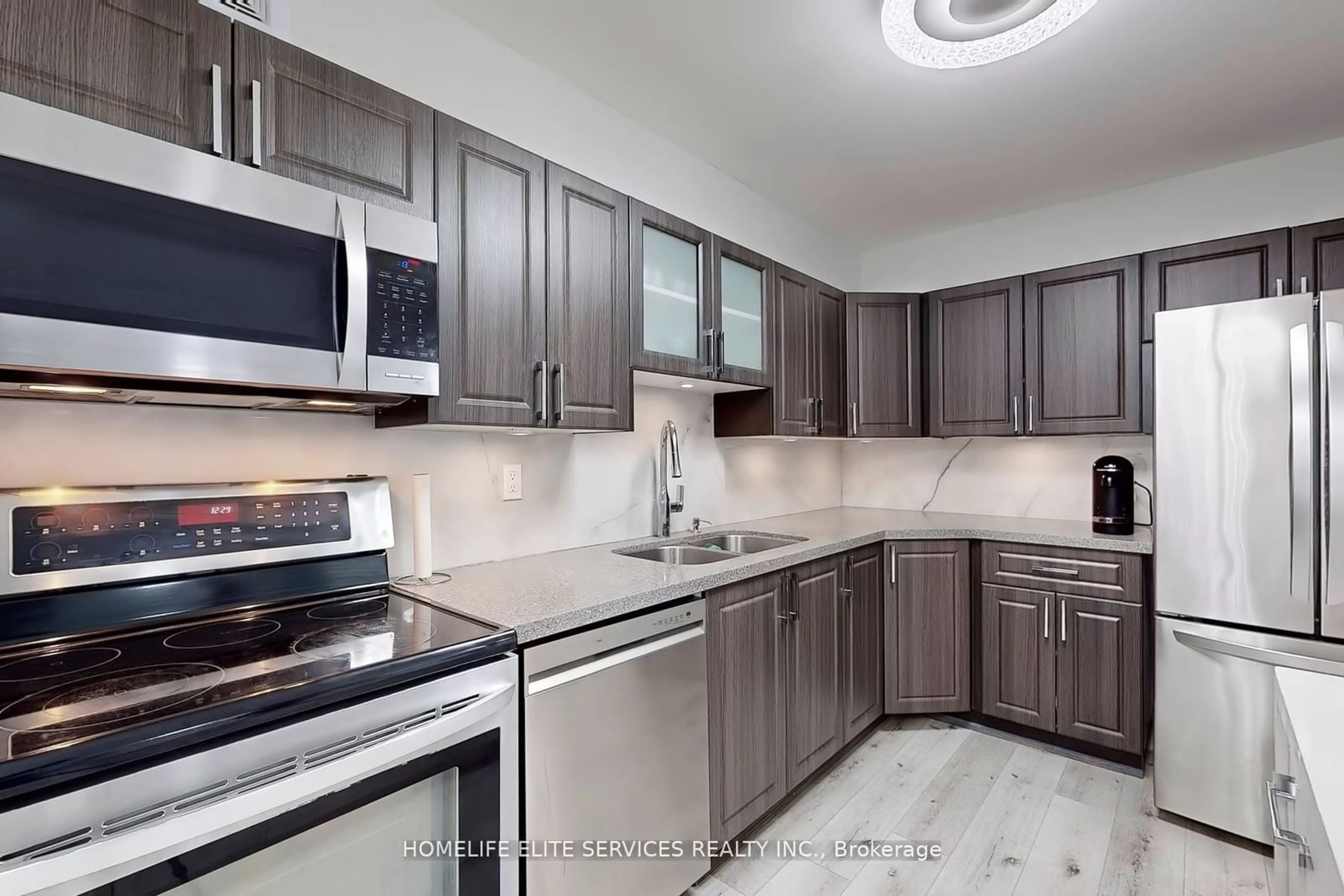 Standard kitchen, wood floors for 120 Dundalk Dr #909, Toronto Ontario M1P 4V9