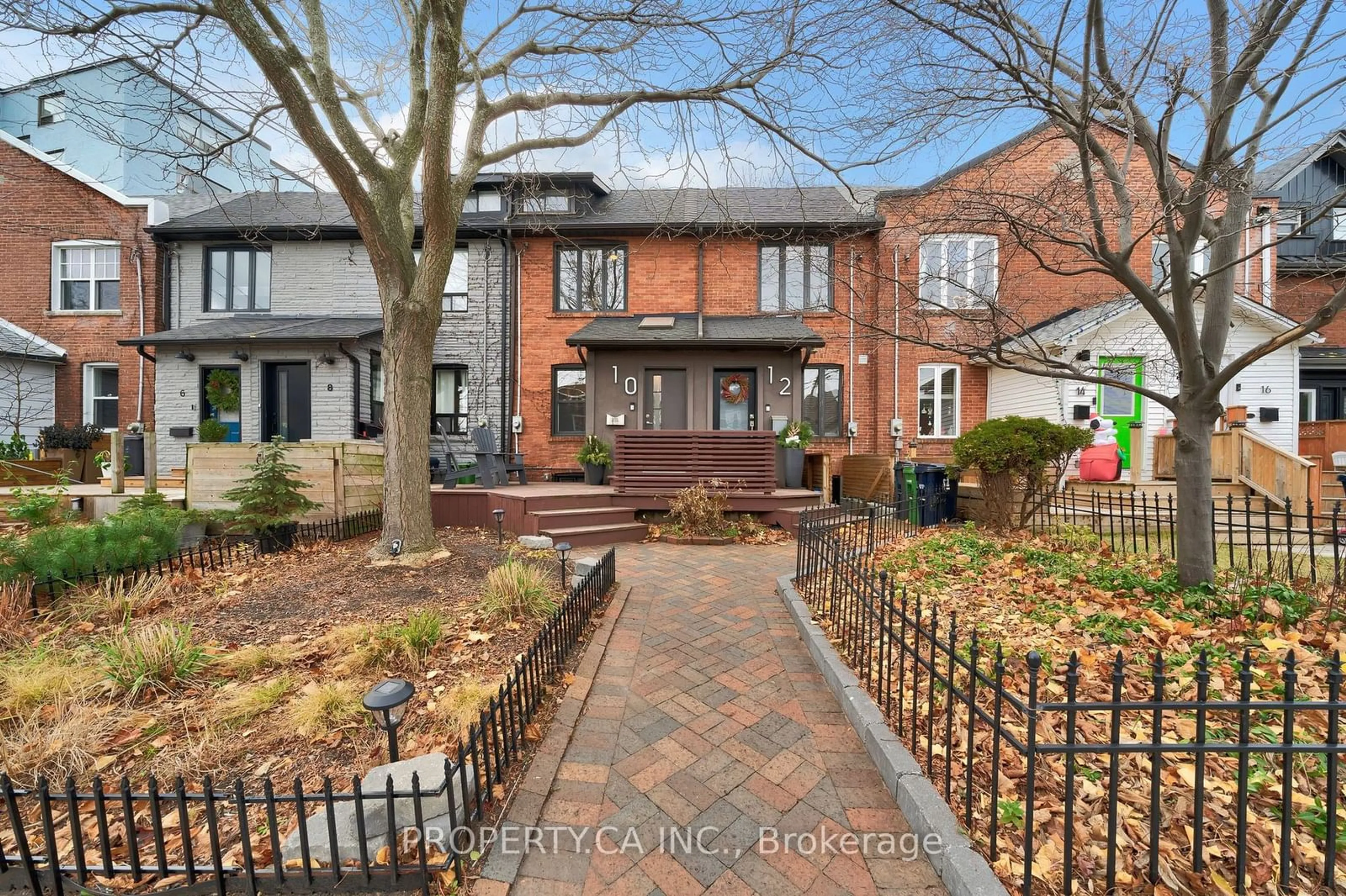 A pic from exterior of the house or condo, the fenced backyard for 10 Hannaford St, Toronto Ontario M4E 3G7