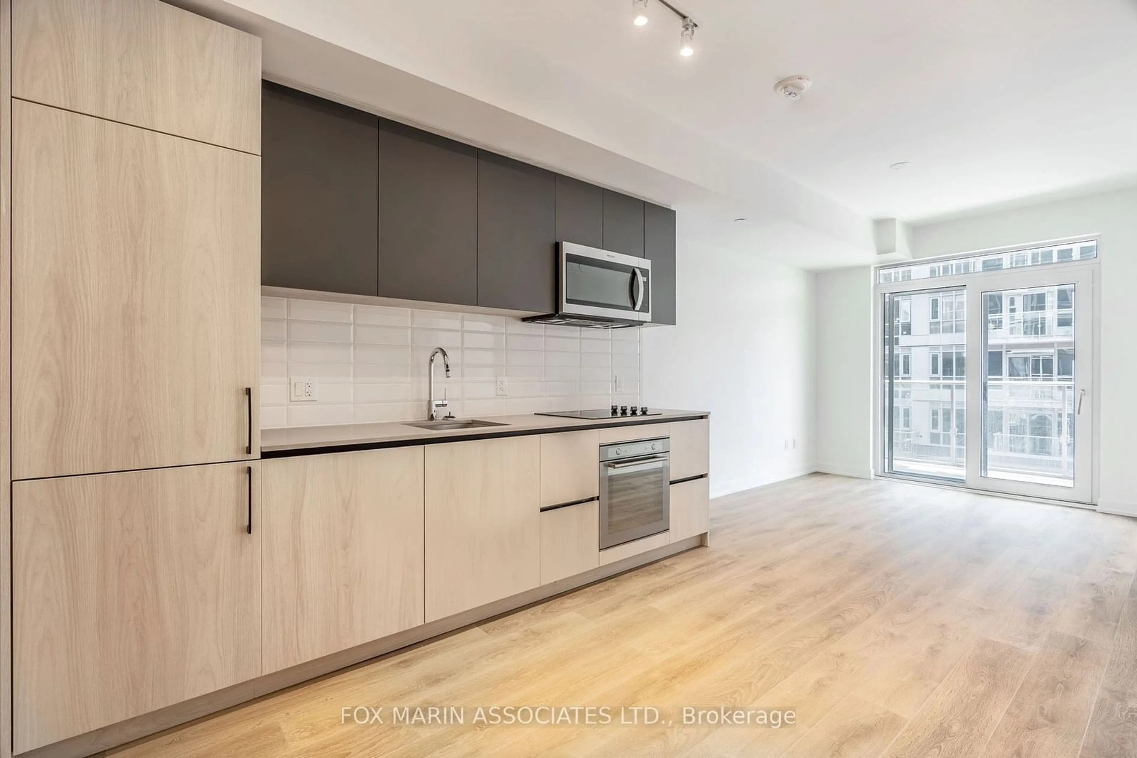 Open concept kitchen for 150 Logan Ave #525, Toronto Ontario M4E 0E4