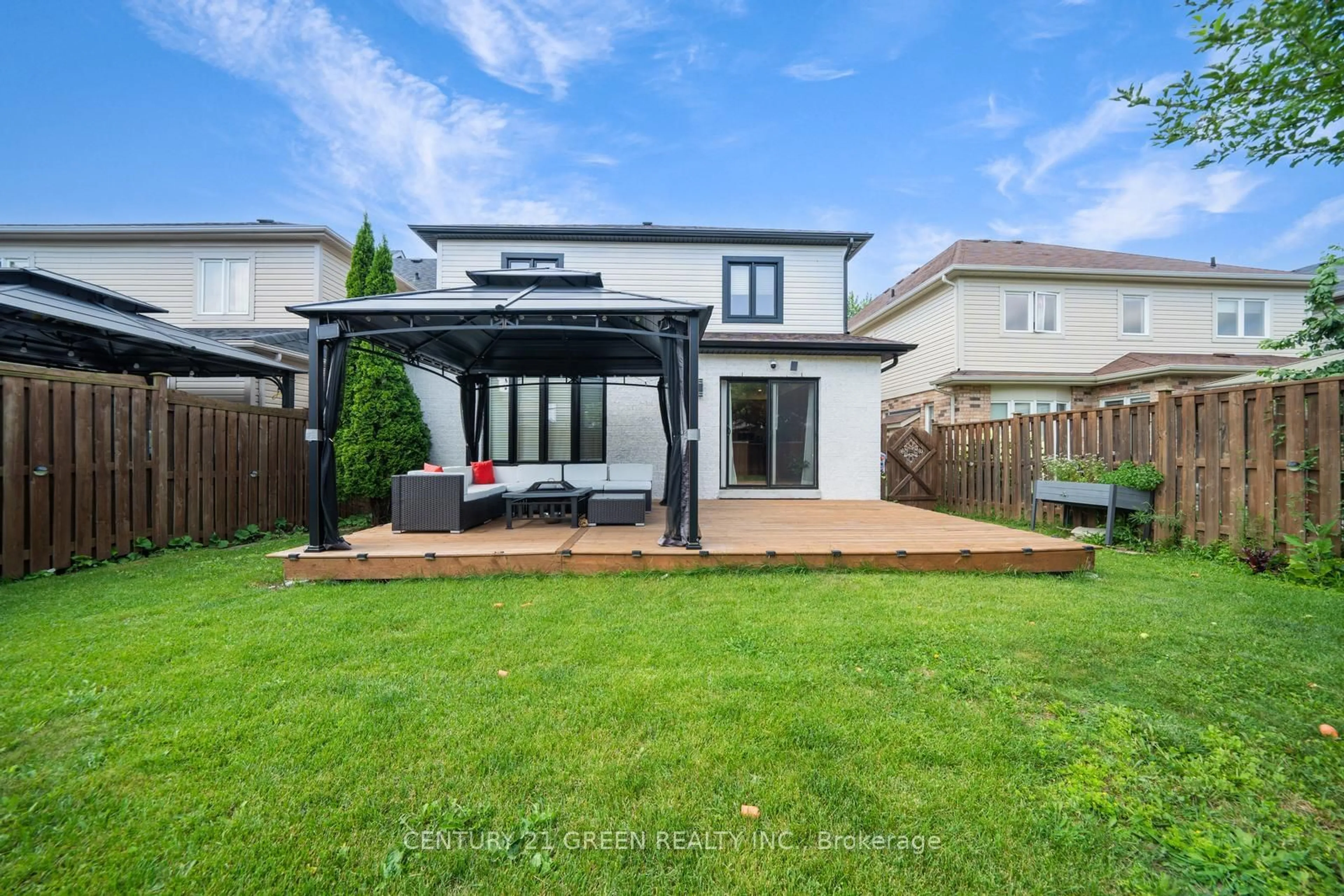 Frontside or backside of a home, the fenced backyard for 625 Autumnwood Tr, Oshawa Ontario L1K 3A9