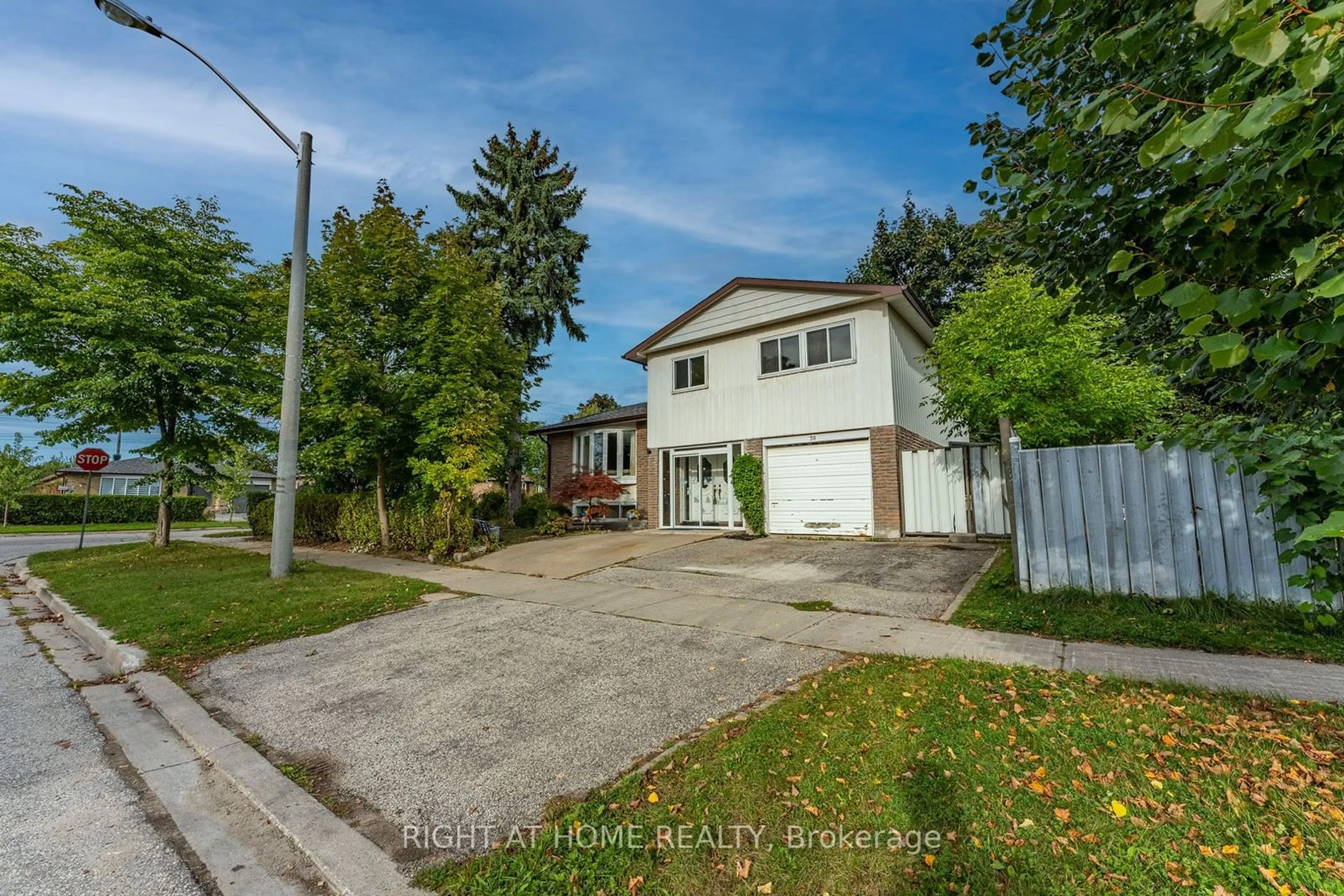 Frontside or backside of a home, the fenced backyard for 39 Boundy Cres, Toronto Ontario M1W 2E3