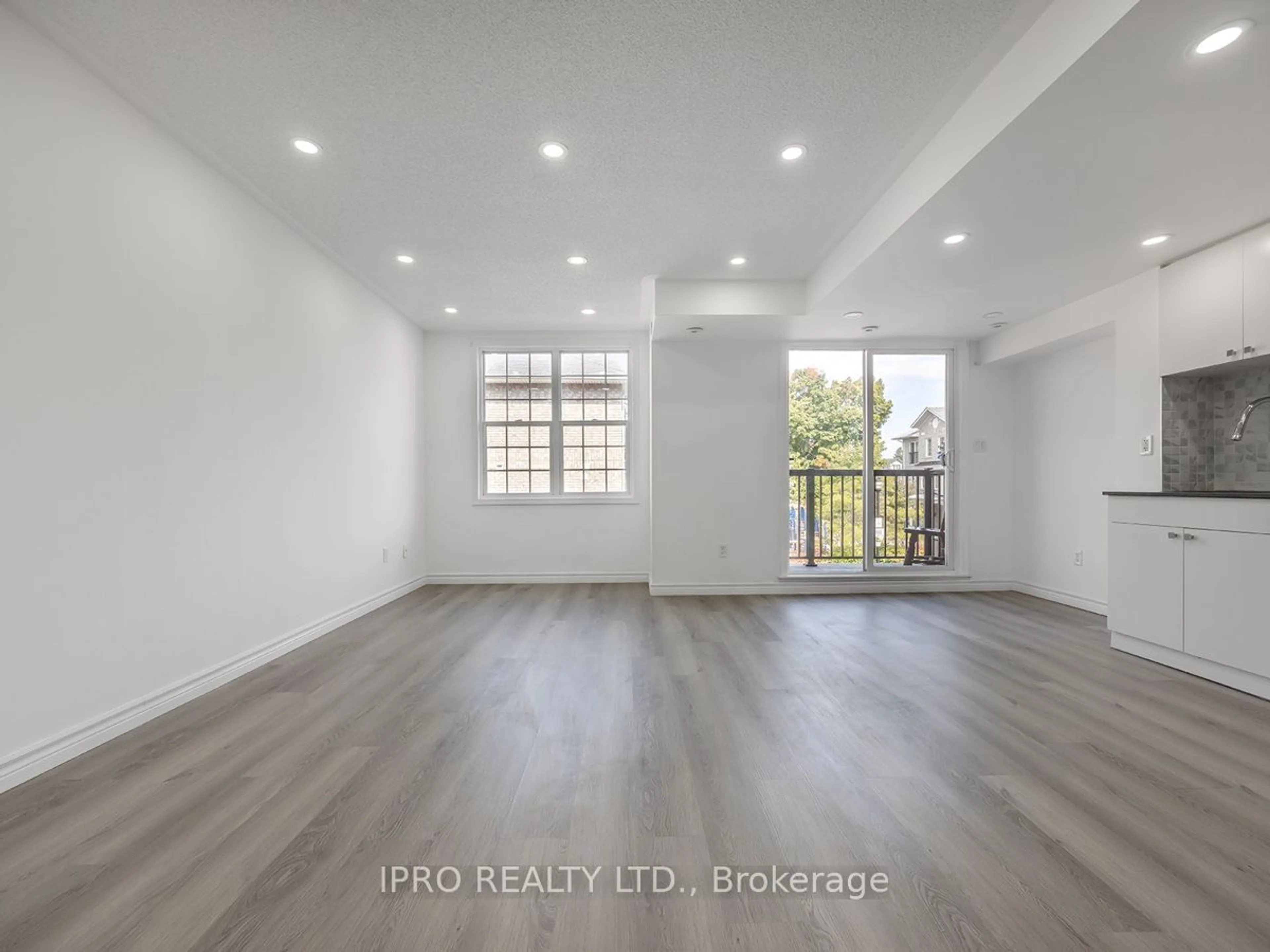 A pic of a room, wood floors for 35 Strangford Lane #305, Toronto Ontario M1L 0E5