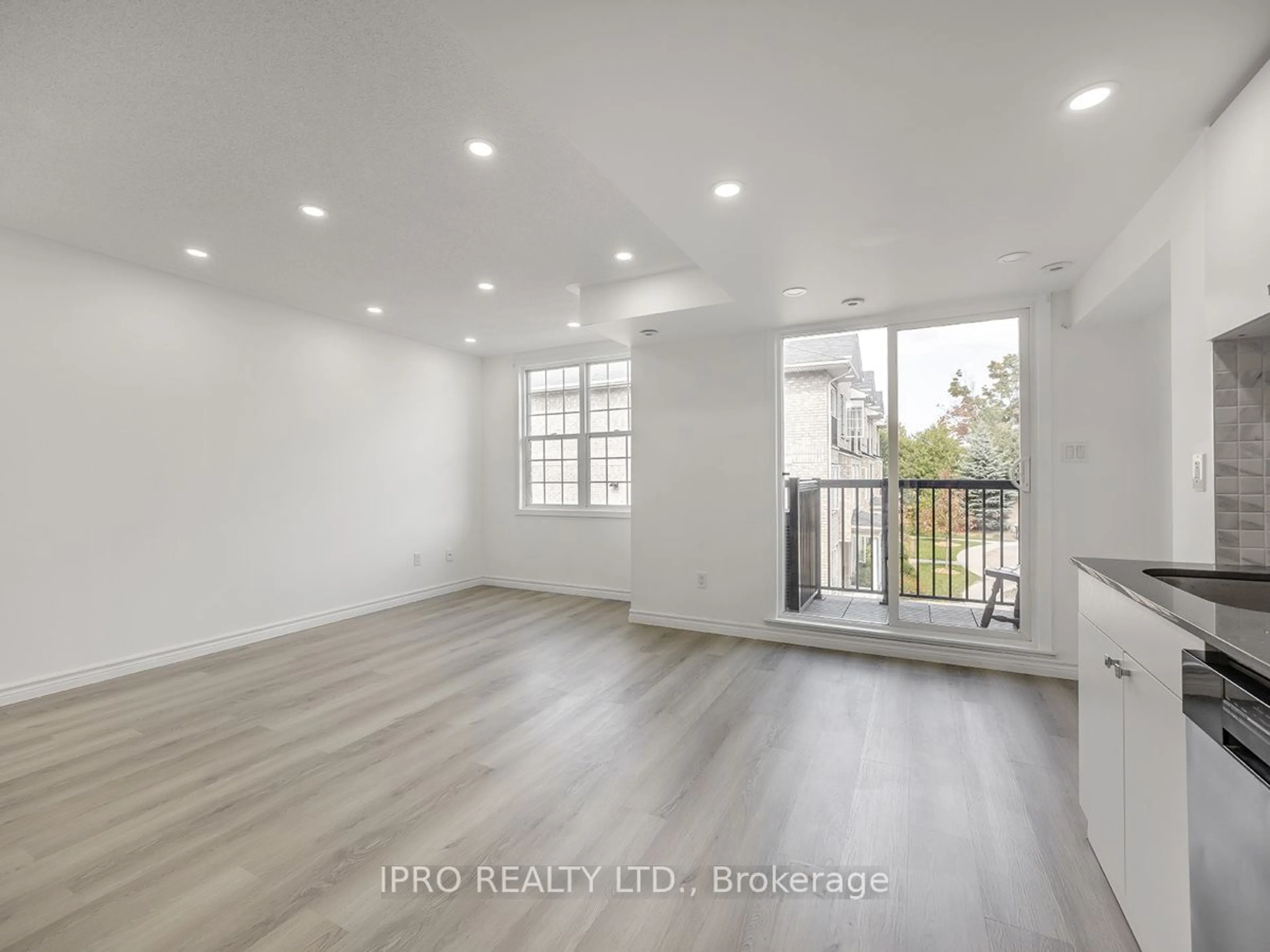 A pic of a room, wood floors for 35 Strangford Lane #305, Toronto Ontario M1L 0E5