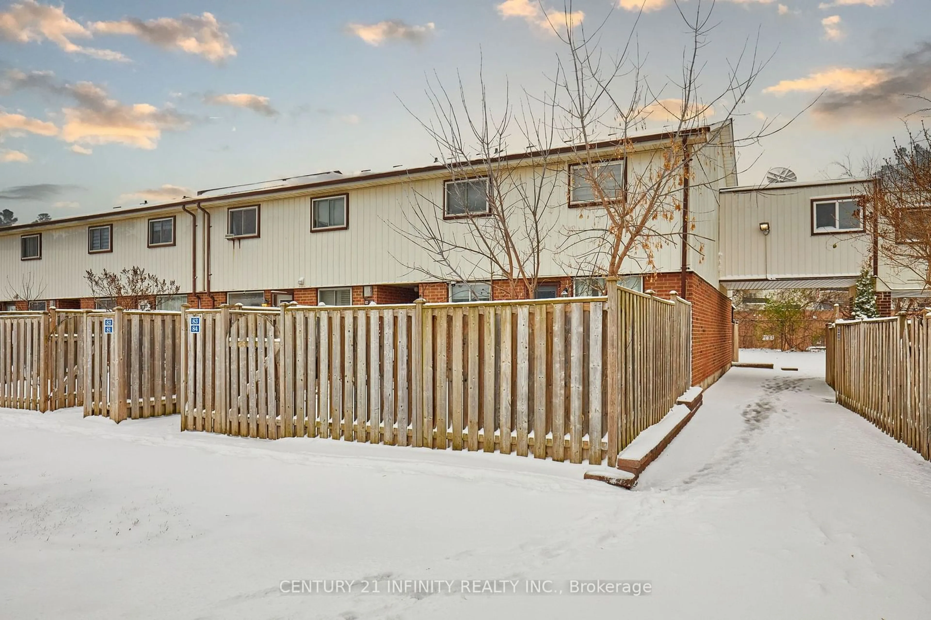 A pic from exterior of the house or condo, the fenced backyard for 120 Nonquon Rd #83, Oshawa Ontario L1G 7E6