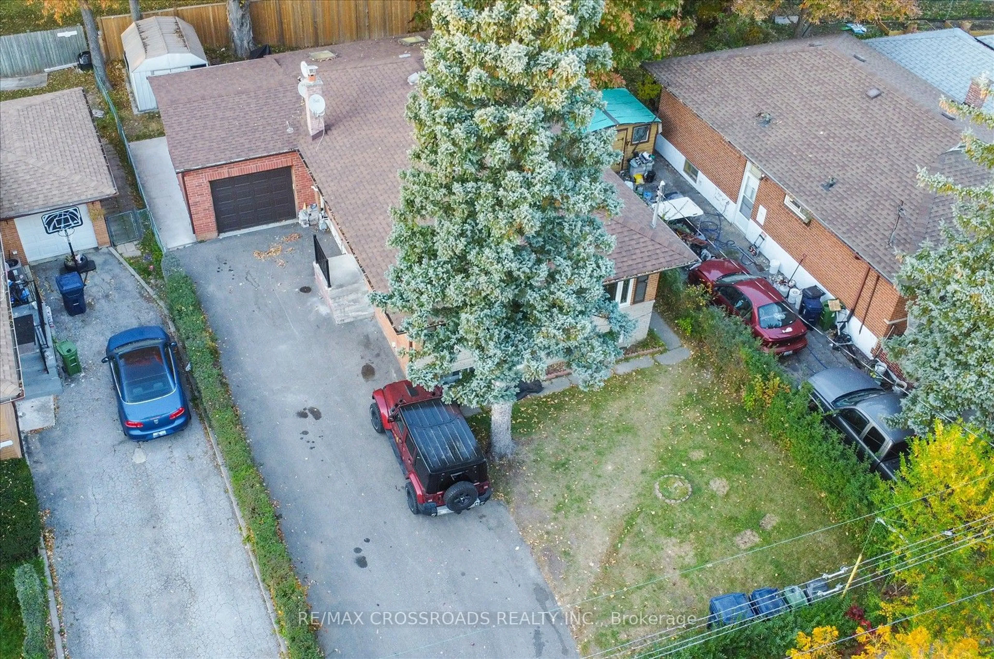 Frontside or backside of a home, the fenced backyard for 64 Chandler Dr, Toronto Ontario M1G 1Z3