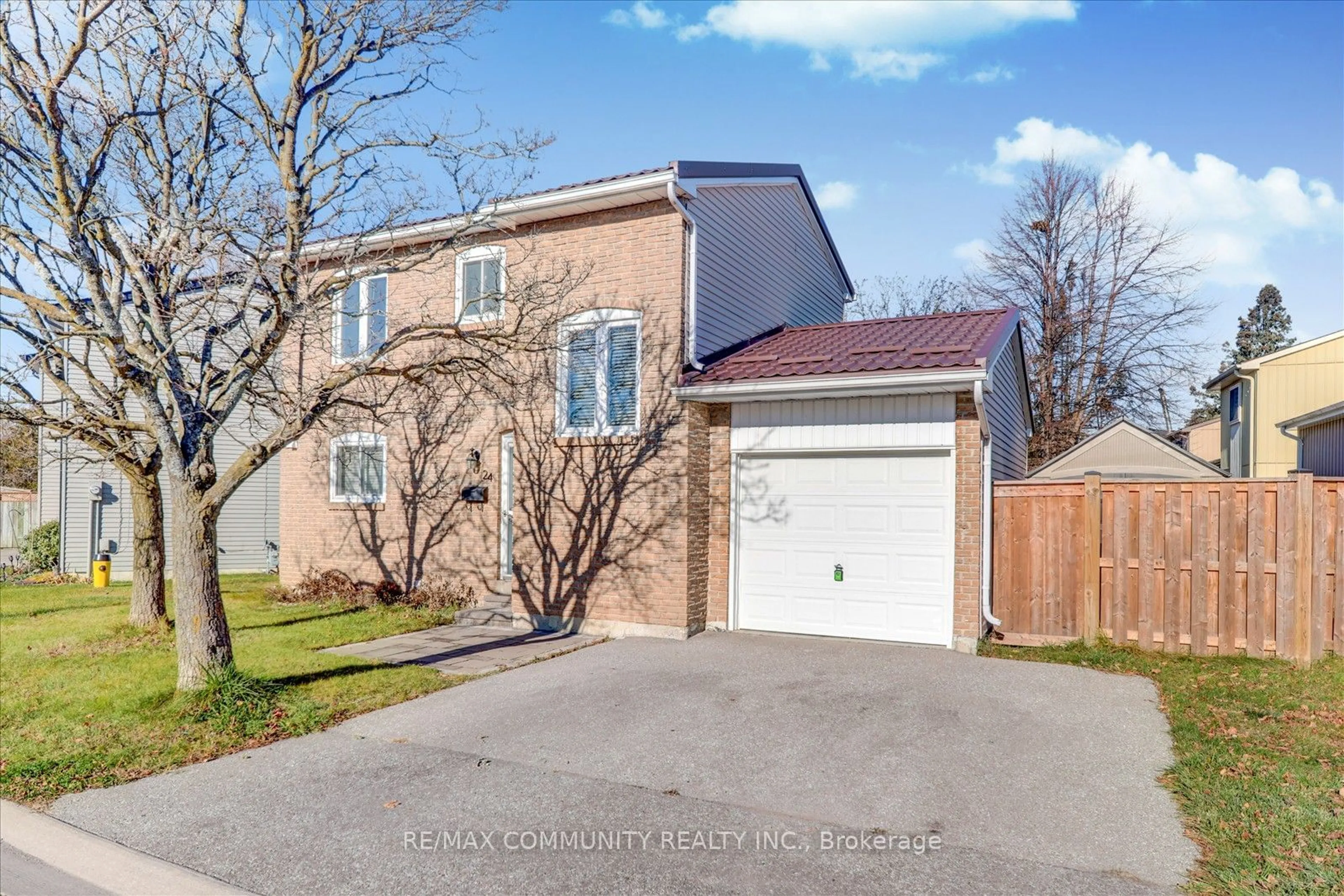 A pic from exterior of the house or condo, the fenced backyard for 24 Medley Lane, Ajax Ontario L1S 3P6