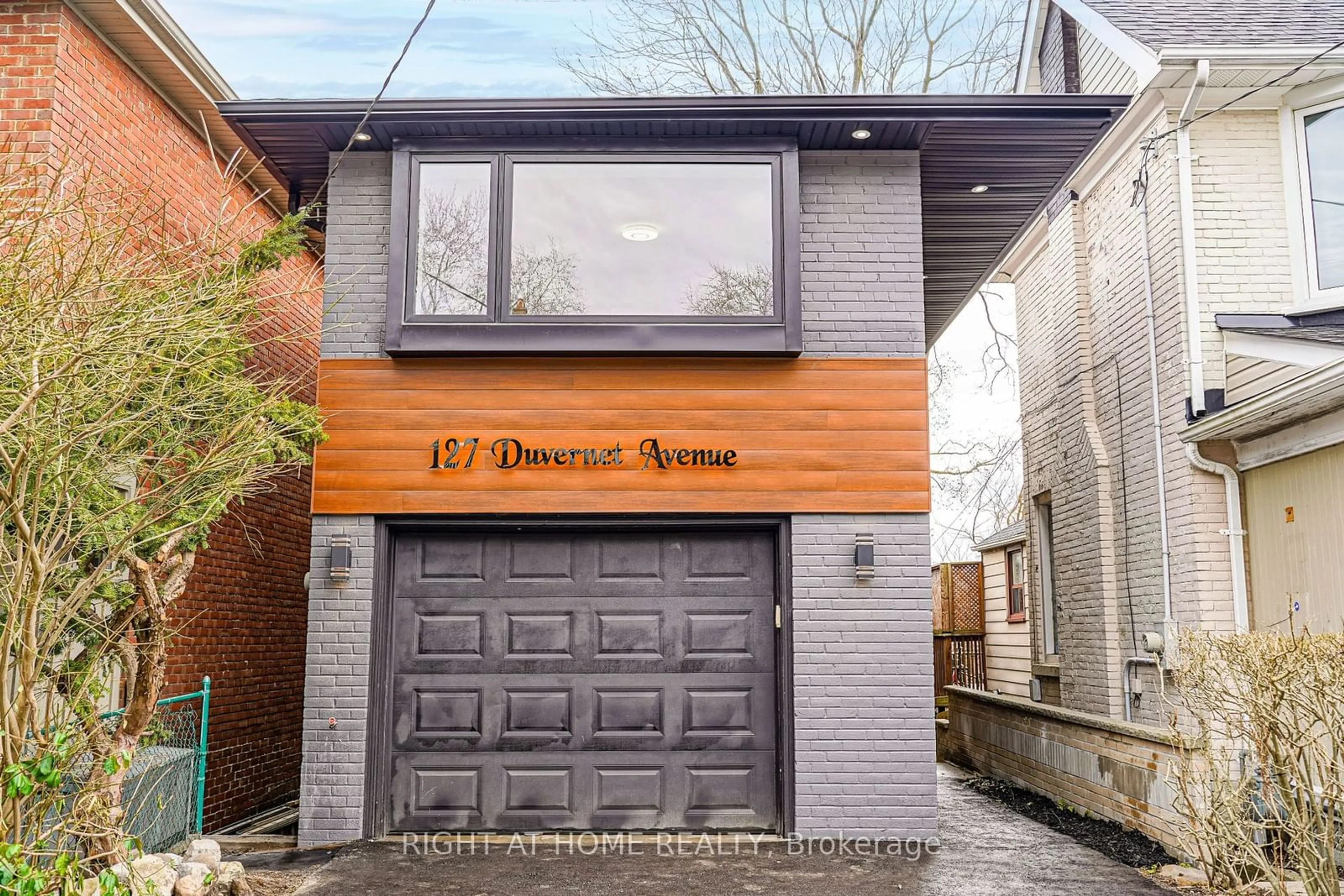 Home with brick exterior material for 127 Duvernet Ave, Toronto Ontario M4E 1V5