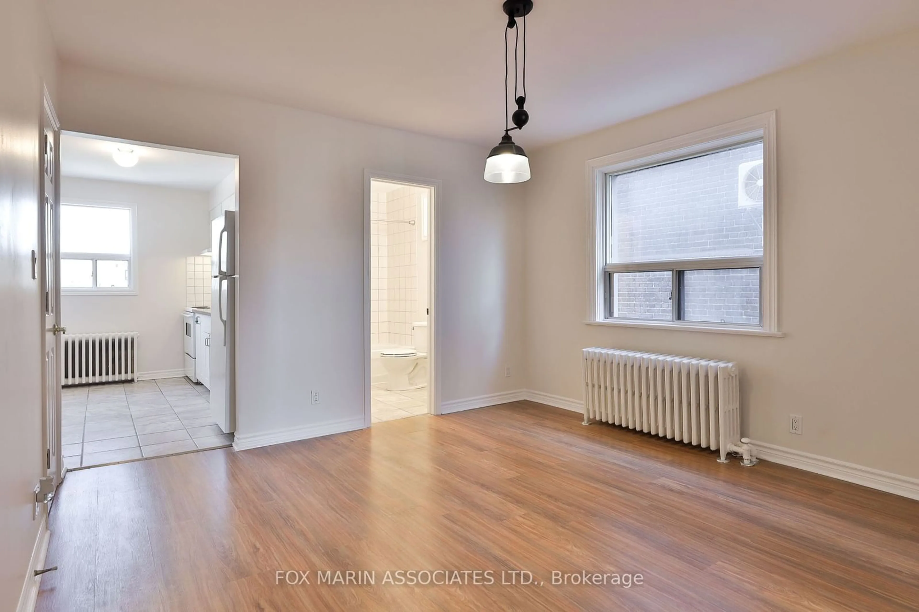 A pic of a room, wood floors for 277 Cedarvale Ave, Toronto Ontario M4C 4K3