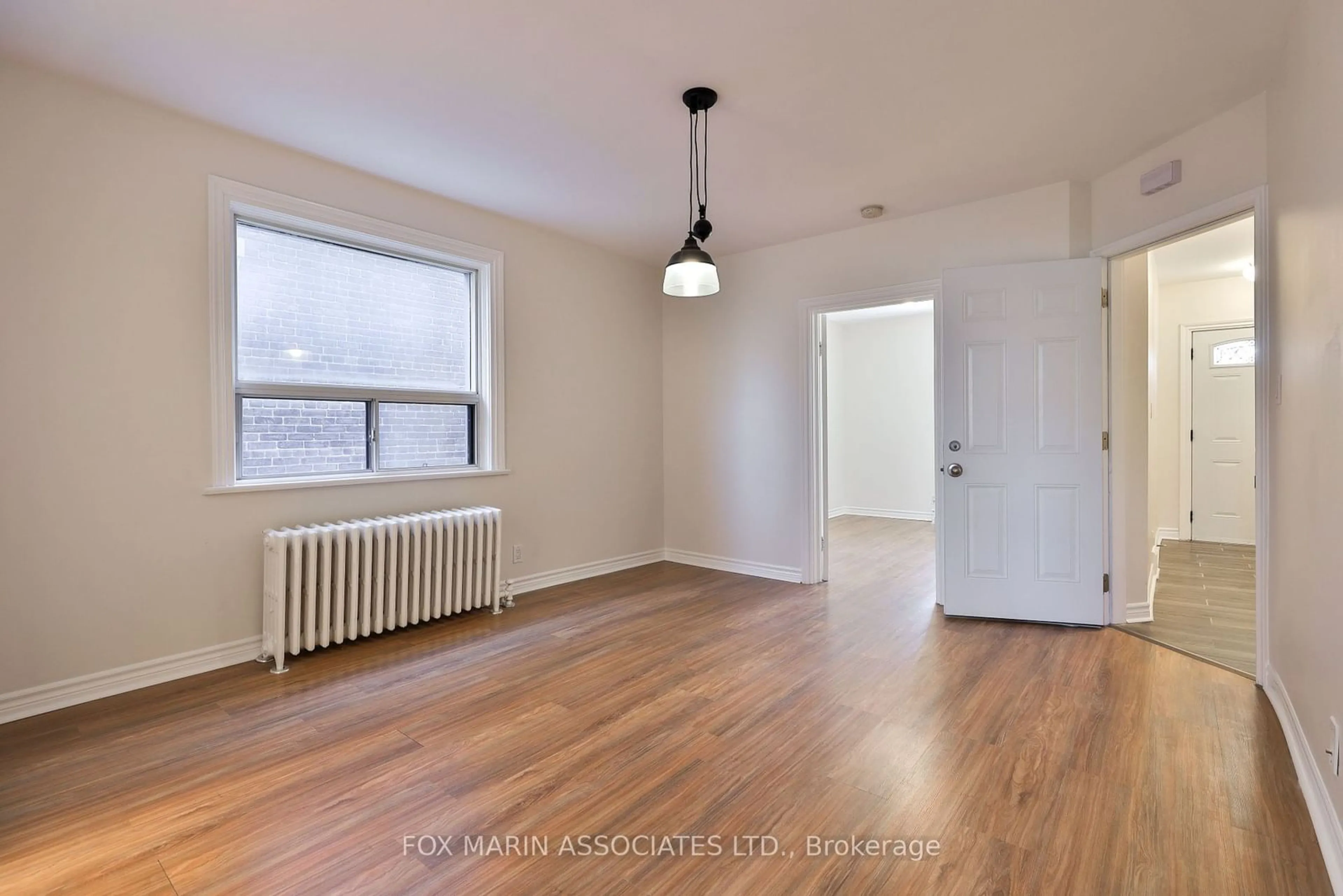 A pic of a room, wood floors for 277 Cedarvale Ave, Toronto Ontario M4C 4K3