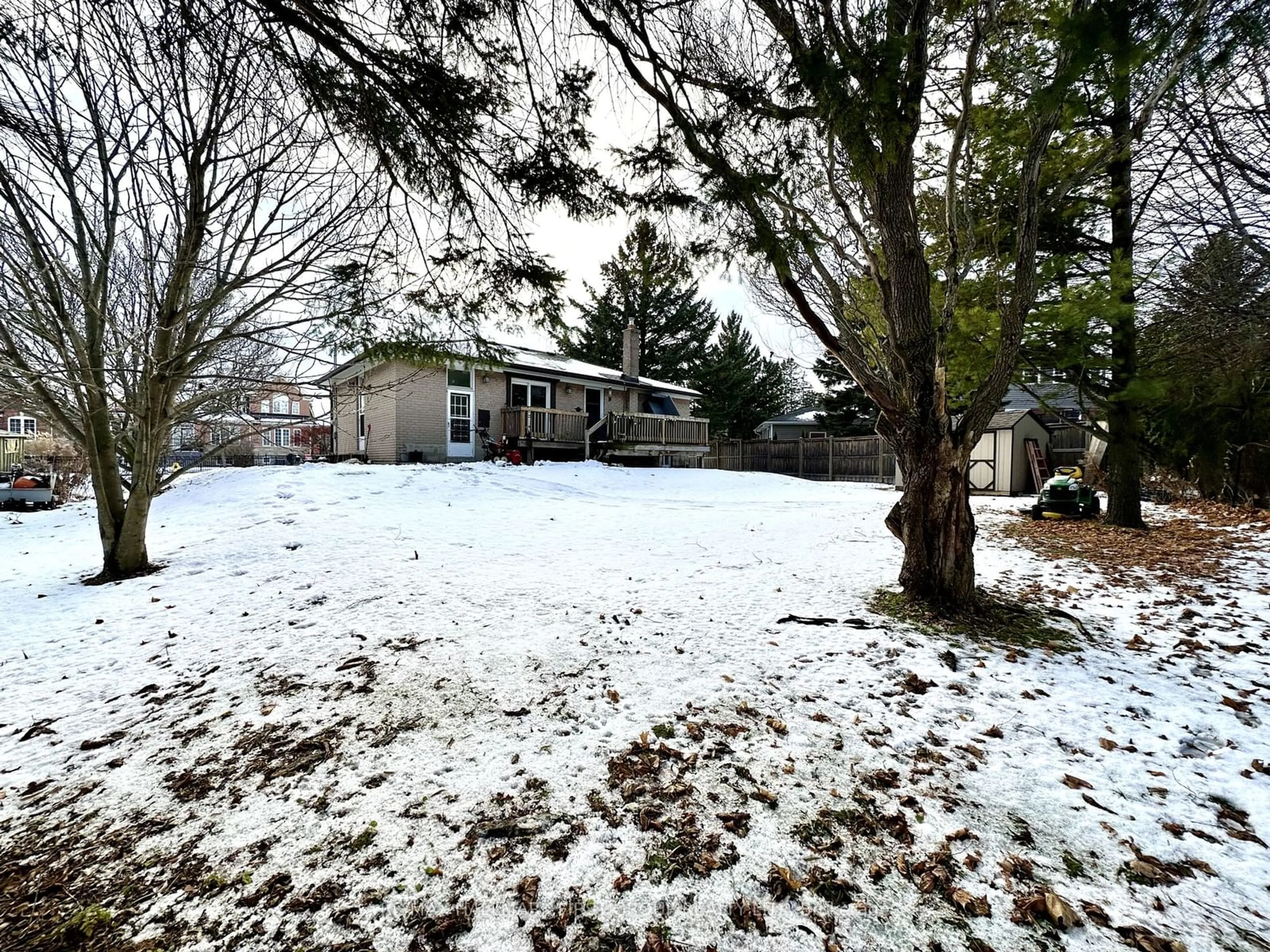 Frontside or backside of a home, the fenced backyard for 10 Heber Down Cres, Whitby Ontario L1M 1A8