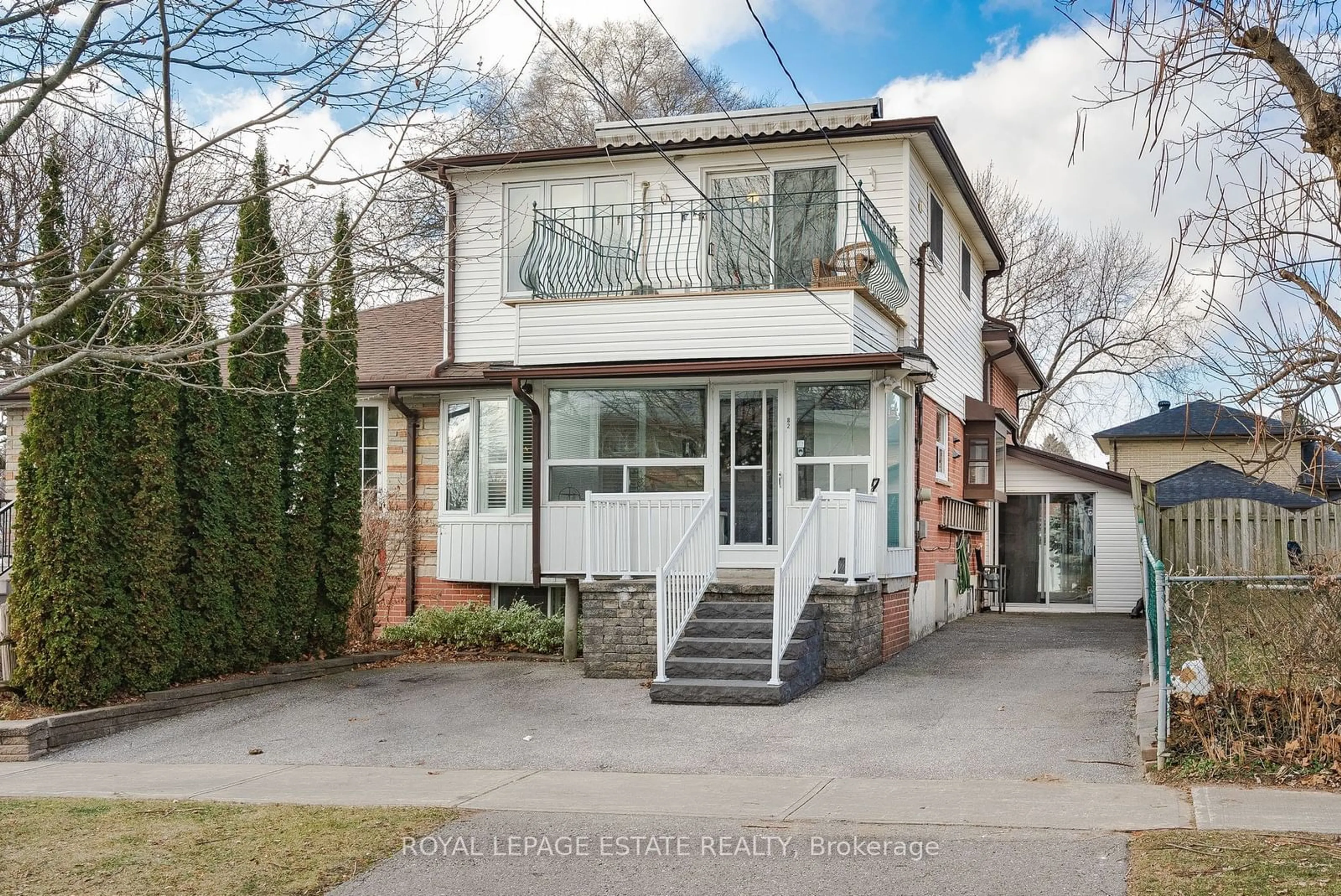 Home with brick exterior material, street for 82 Lochleven Dr, Toronto Ontario M1M 2Z3