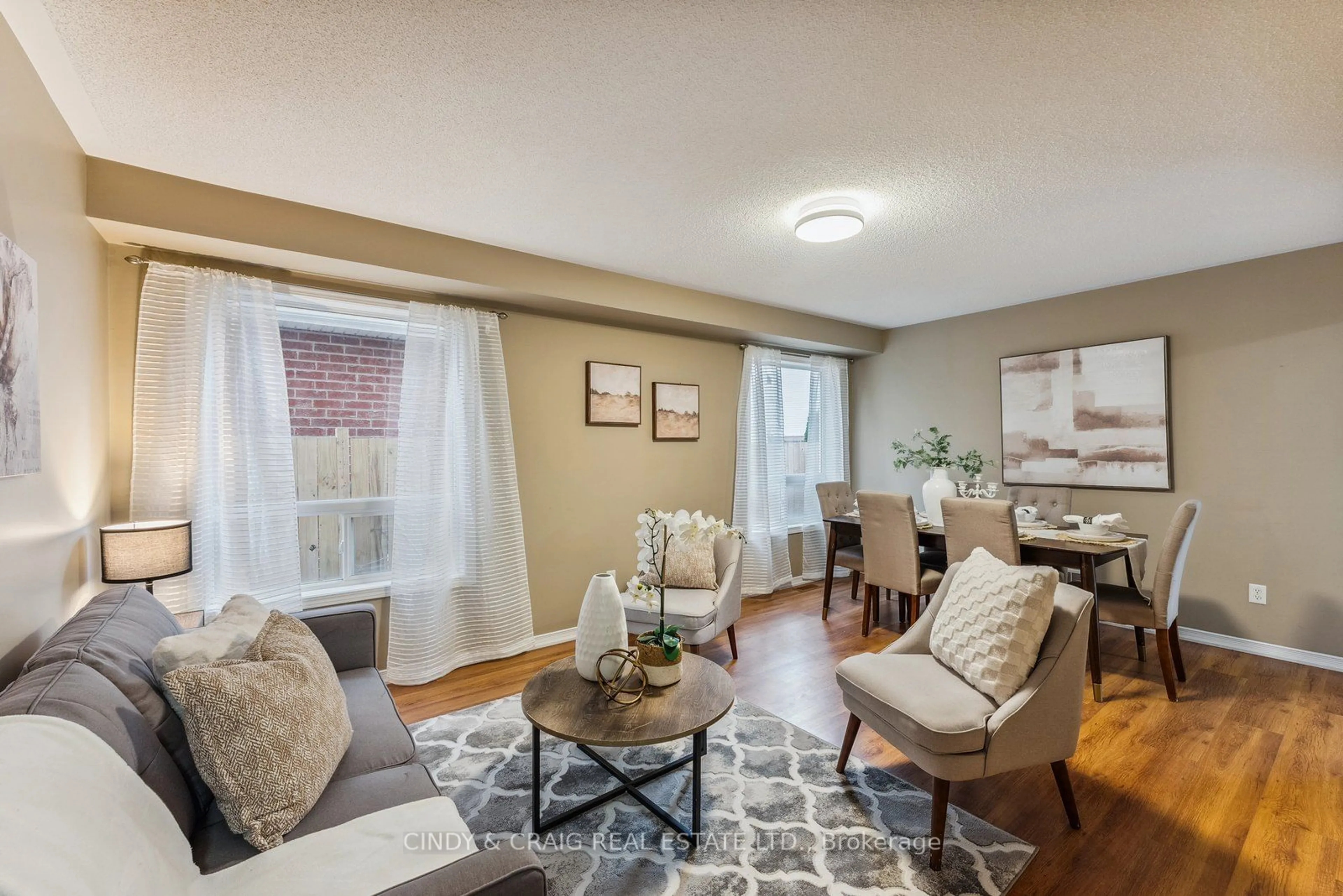 Living room with furniture, wood/laminate floor for 1555 Glenbourne Dr, Oshawa Ontario L1K 0M3