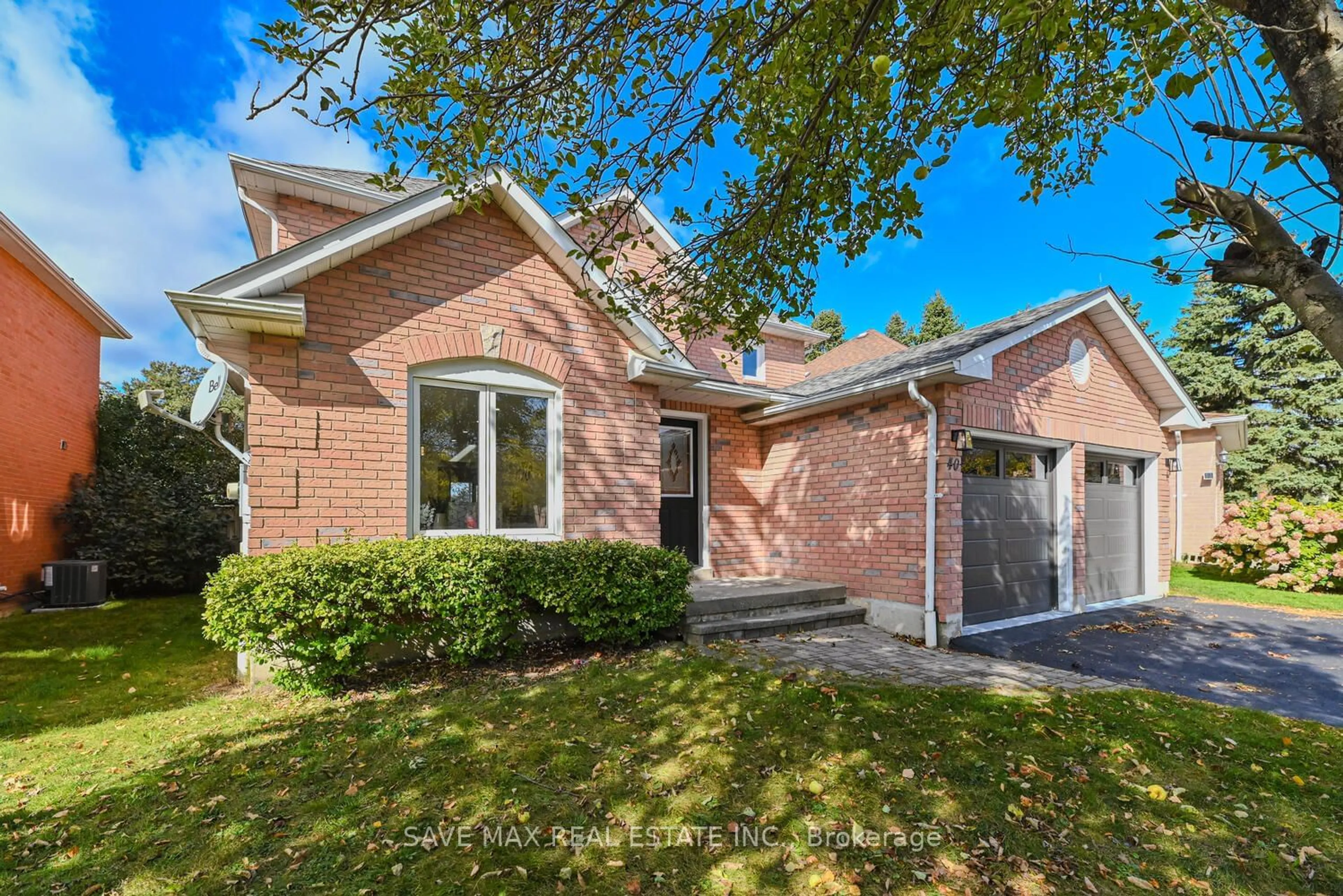 Home with brick exterior material, street for 40 Eric Clarke Dr, Whitby Ontario L1R 2H7