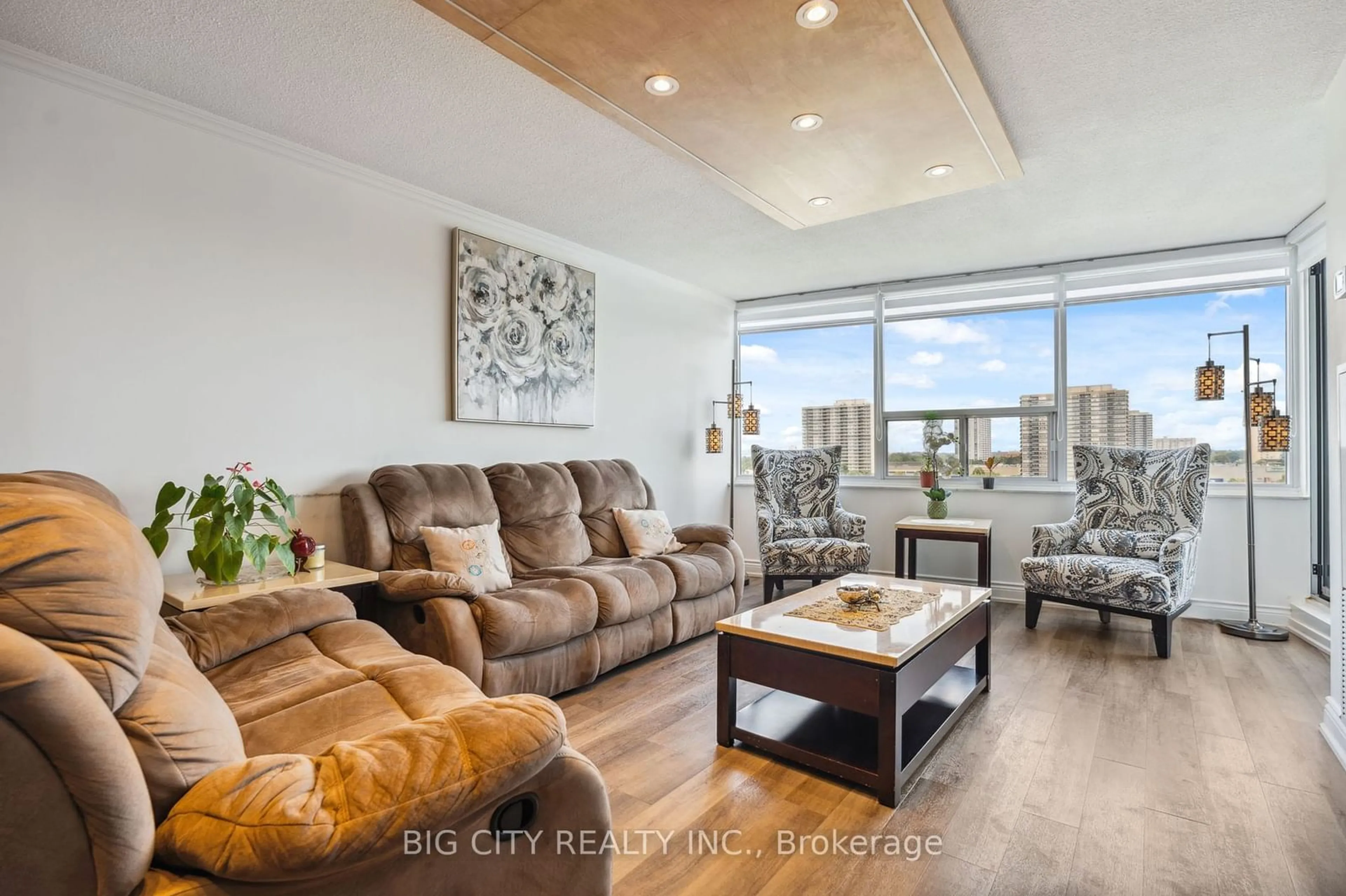 Living room with furniture, wood/laminate floor for 55 Huntingdale Blvd #904, Toronto Ontario M1W 2N9