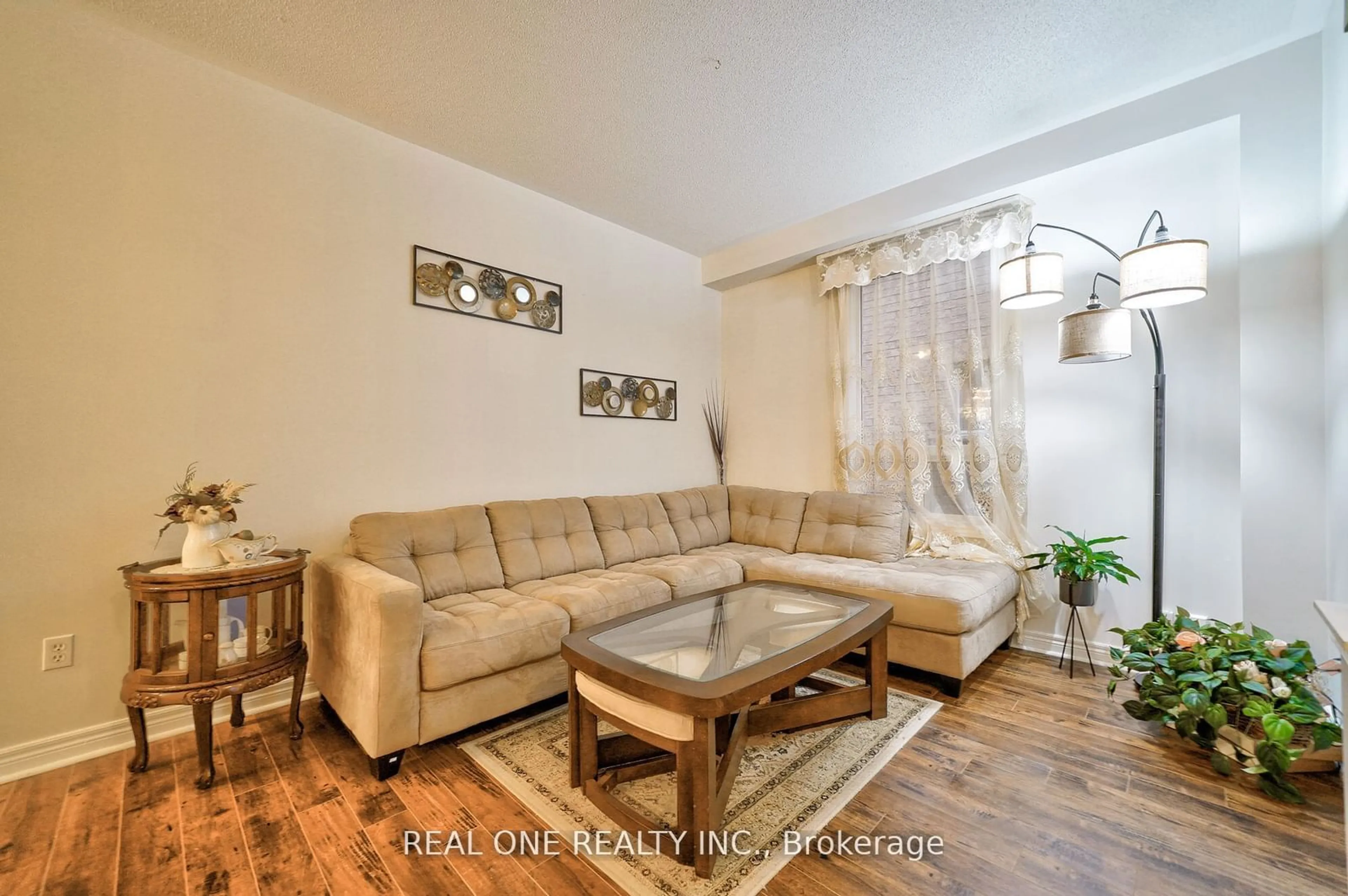 Living room with furniture, wood/laminate floor for 41 Timbercreek Crt, Toronto Ontario M1W 4A1