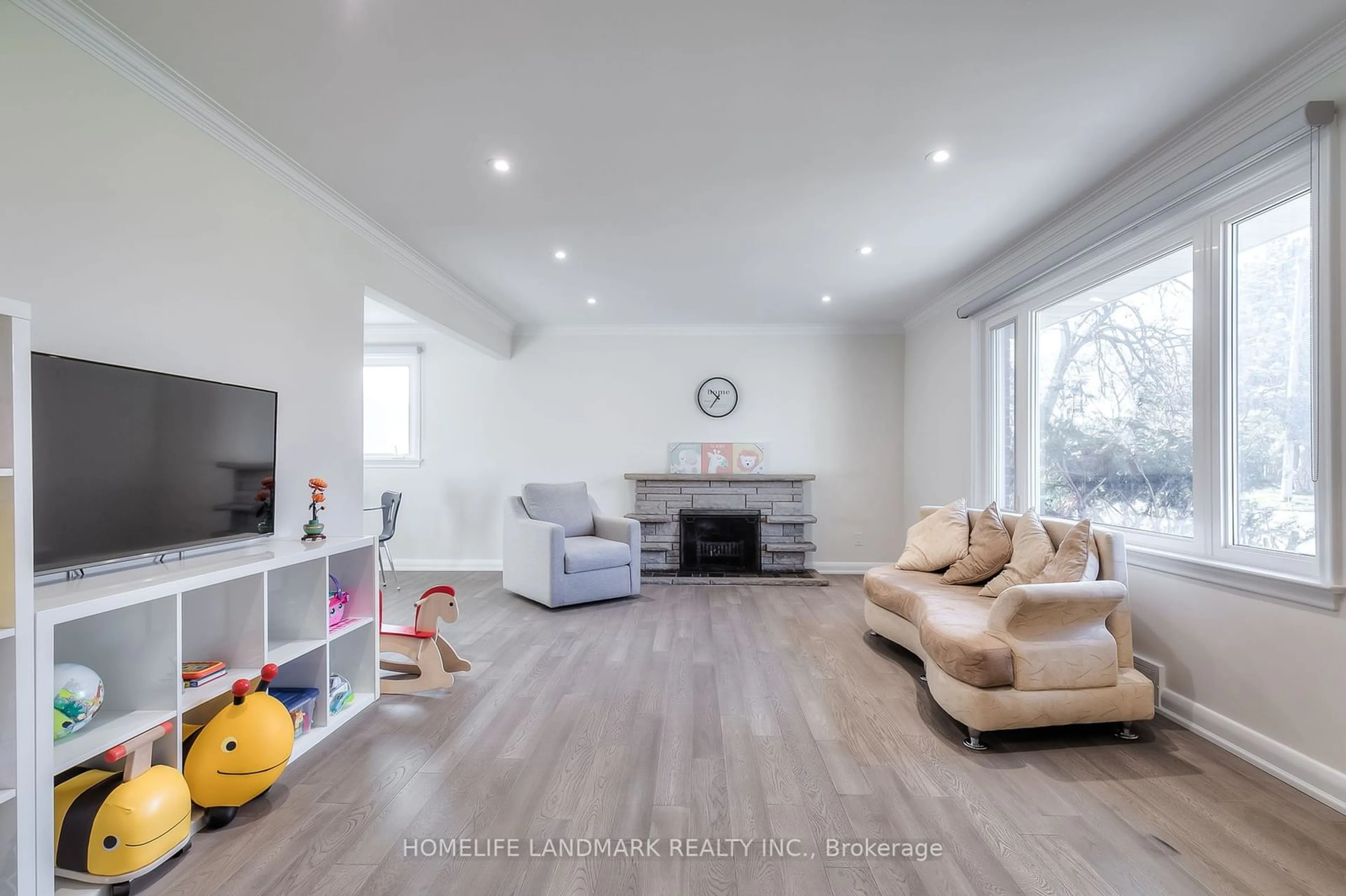 Living room with furniture, wood/laminate floor for 177 Allanford Rd, Toronto Ontario M1T 2P1