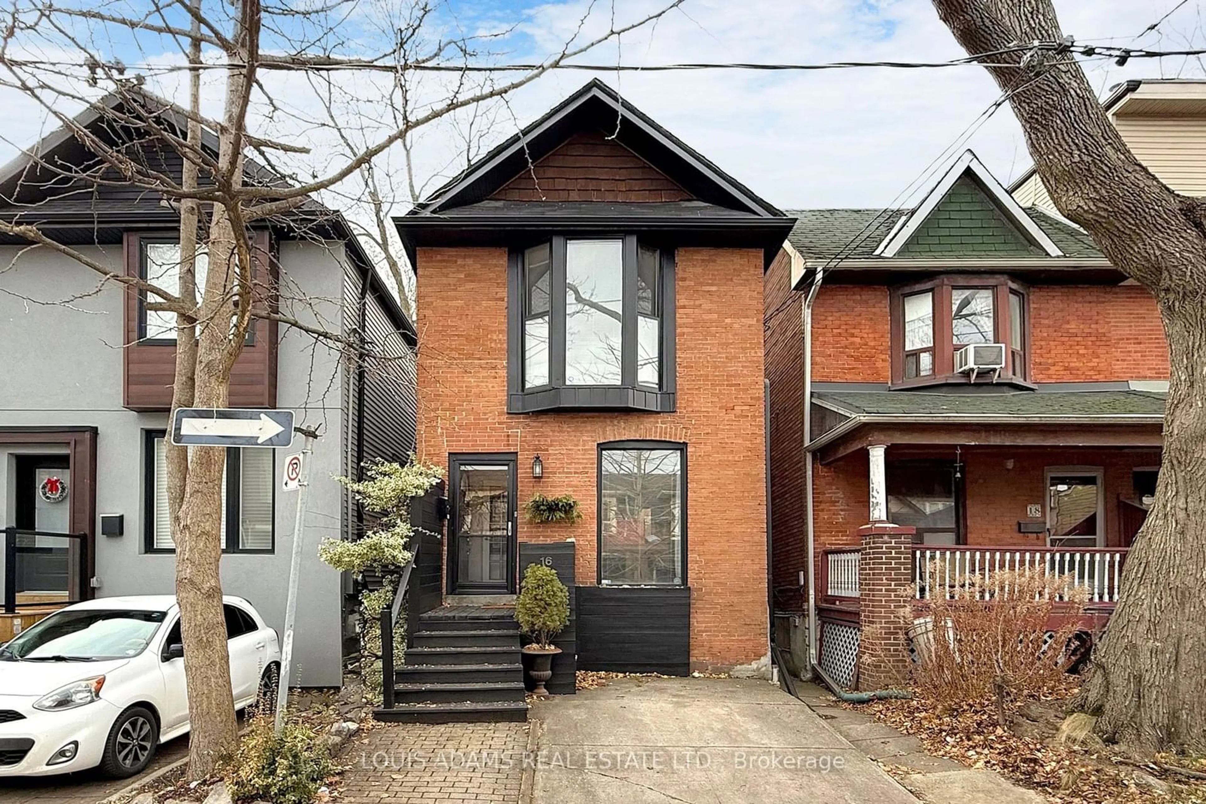 Home with brick exterior material, street for 16 Winnifred Ave, Toronto Ontario M4M 2X3