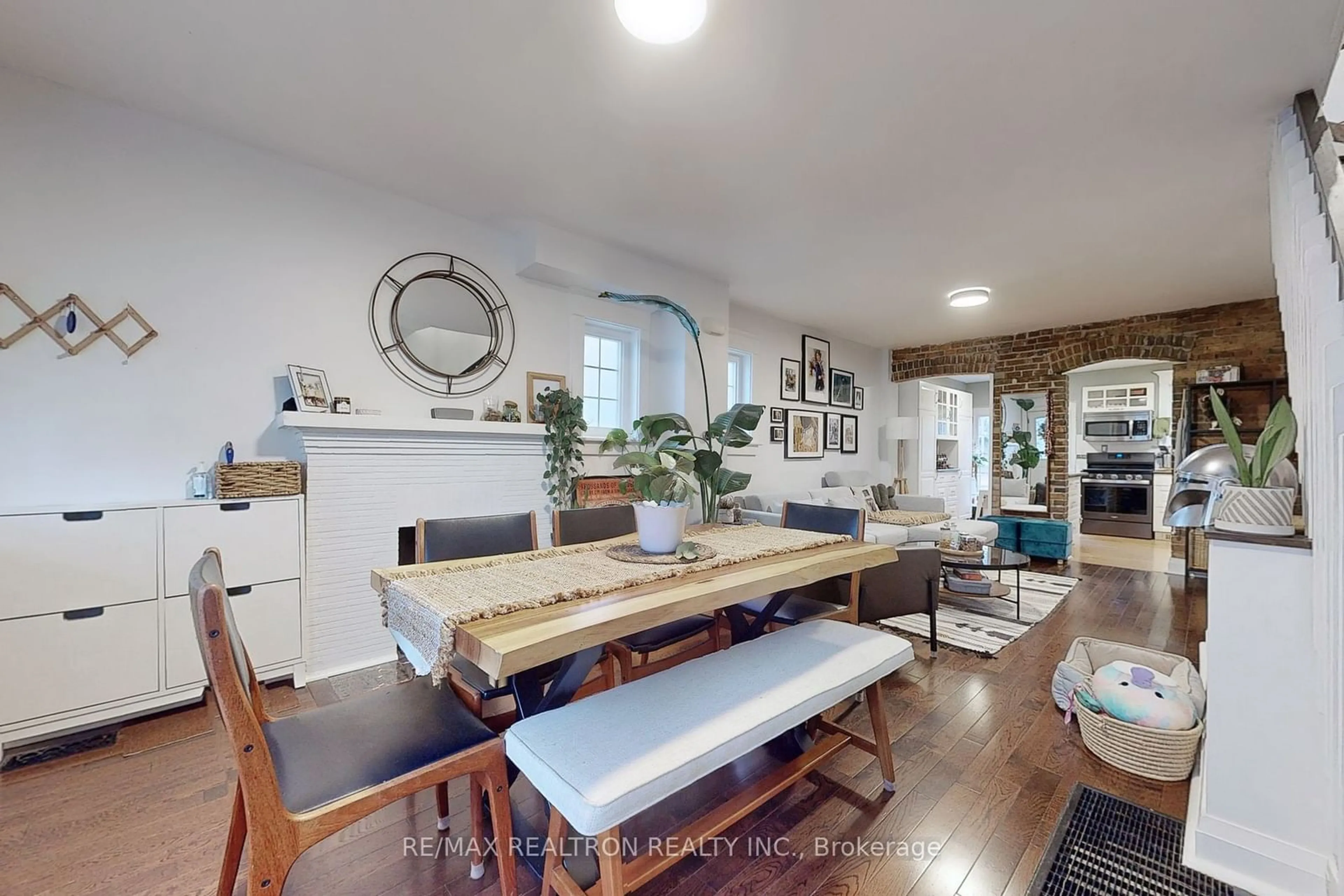 Dining room, wood/laminate floor for 1578 Dundas St, Toronto Ontario M4L 1K8