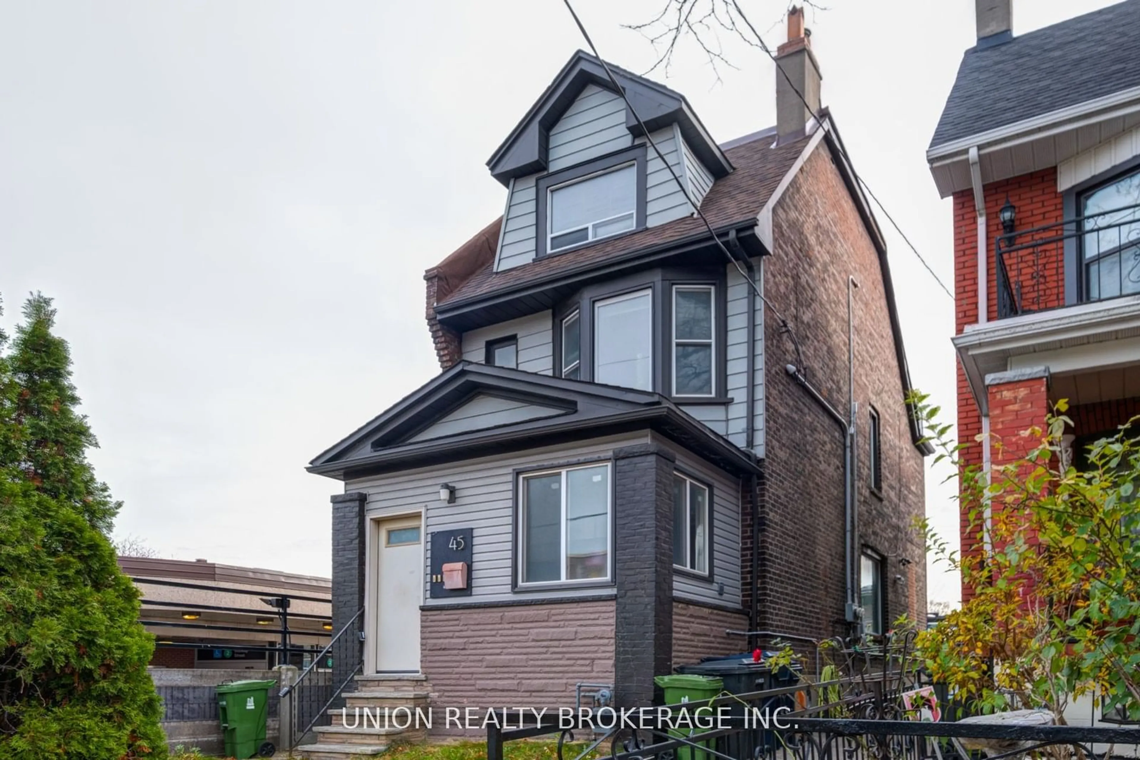 Home with brick exterior material, street for 45 Strathmore Blvd, Toronto Ontario M4C 1N5