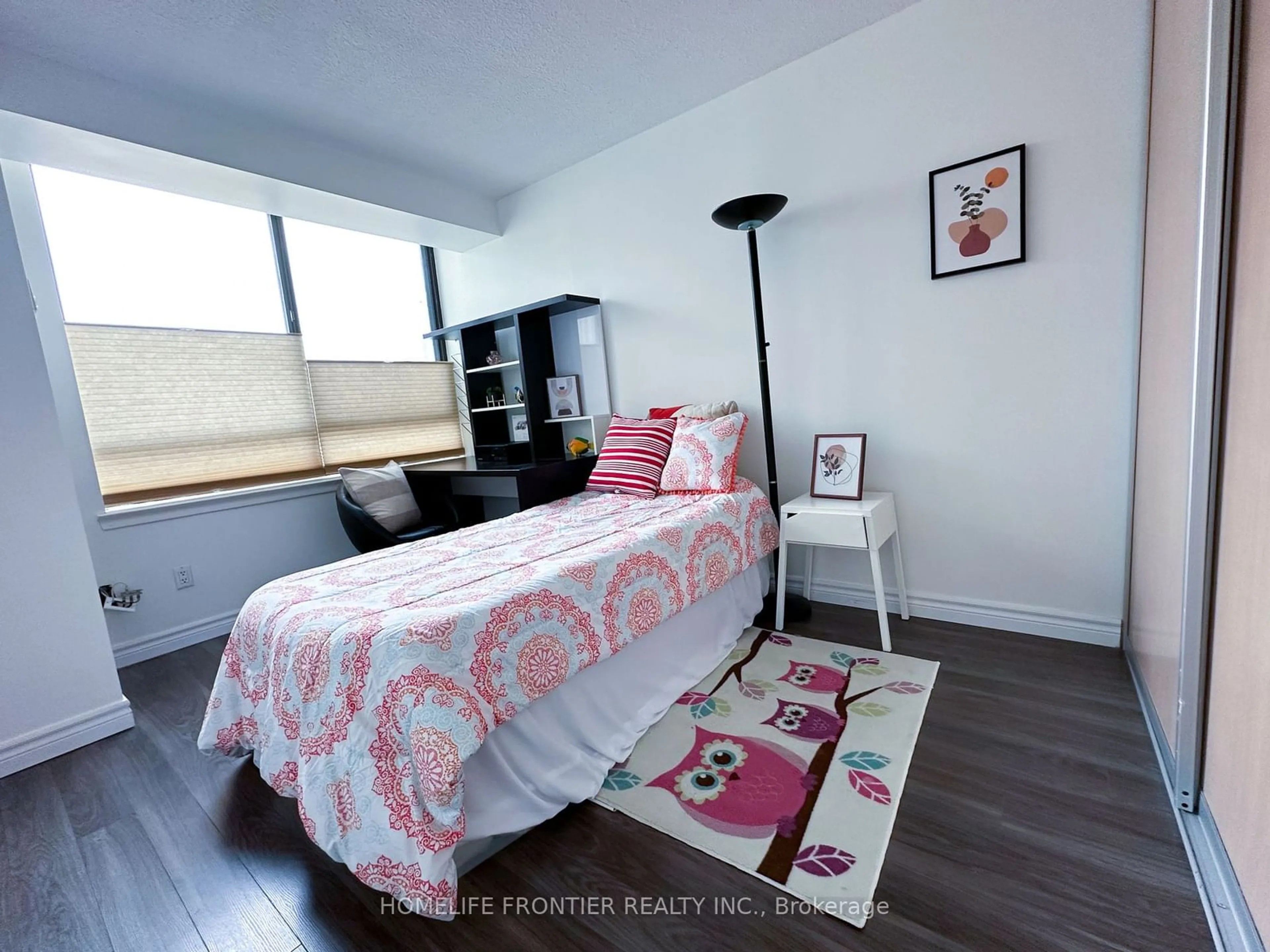 Bedroom with bed, wood/laminate floor for 75 Bamburgh Circ #222, Toronto Ontario M3W 3W1