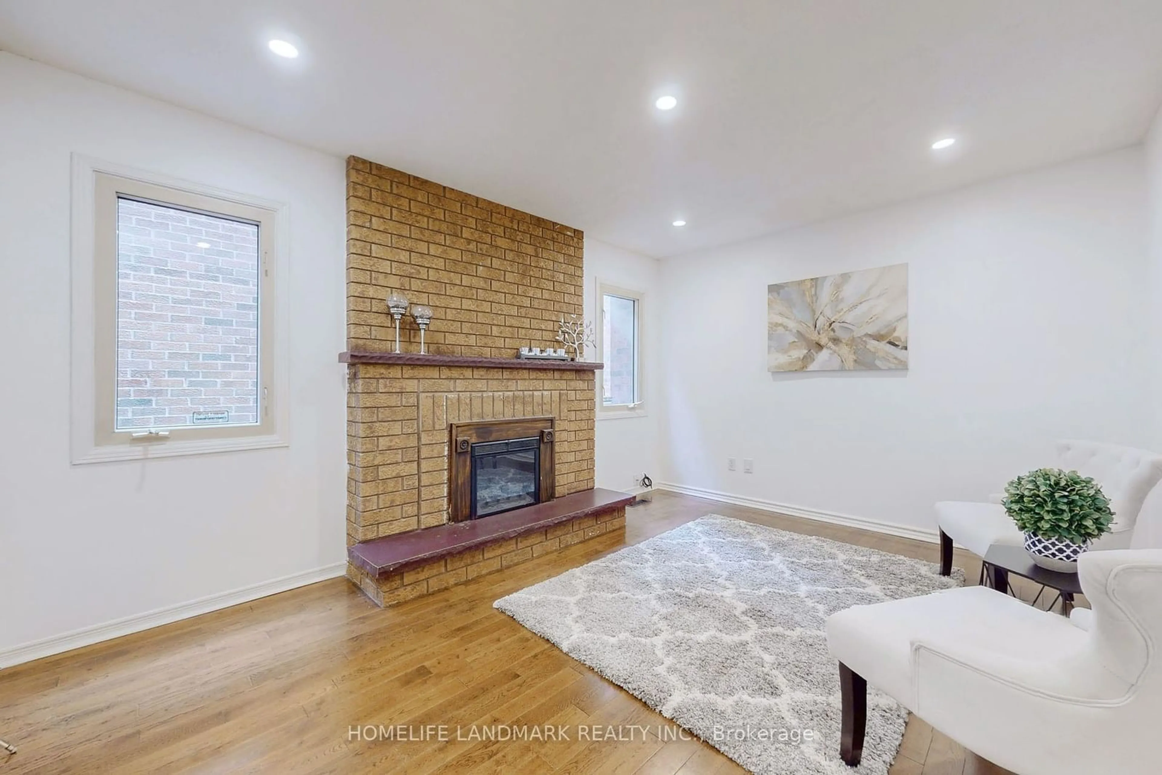 Living room with furniture, wood/laminate floor for 19 Myrna Lane, Toronto Ontario M1V 3N6