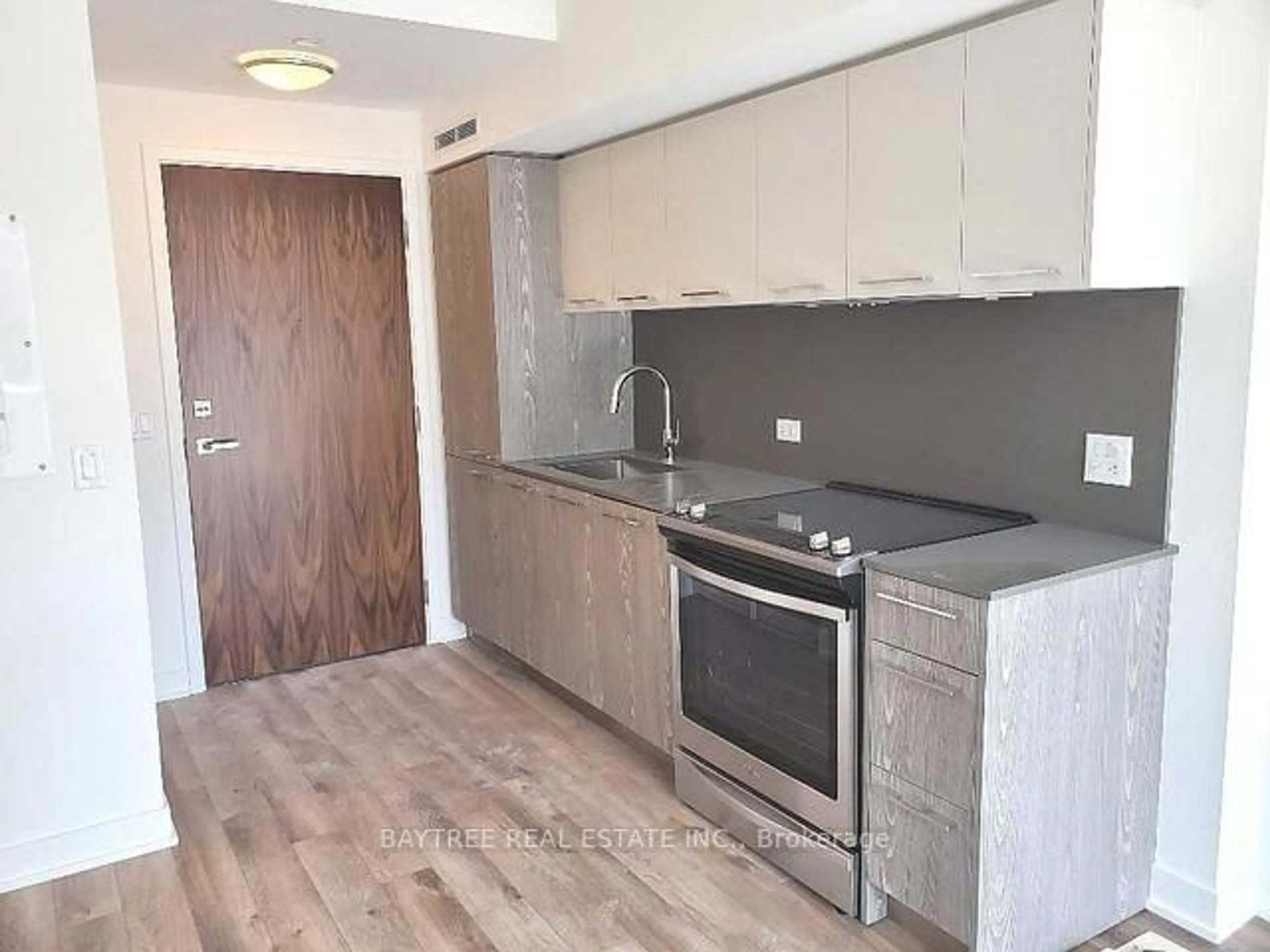 Standard kitchen, wood/laminate floor for 30 Baseball Pl #912, Toronto Ontario M4M 0E8