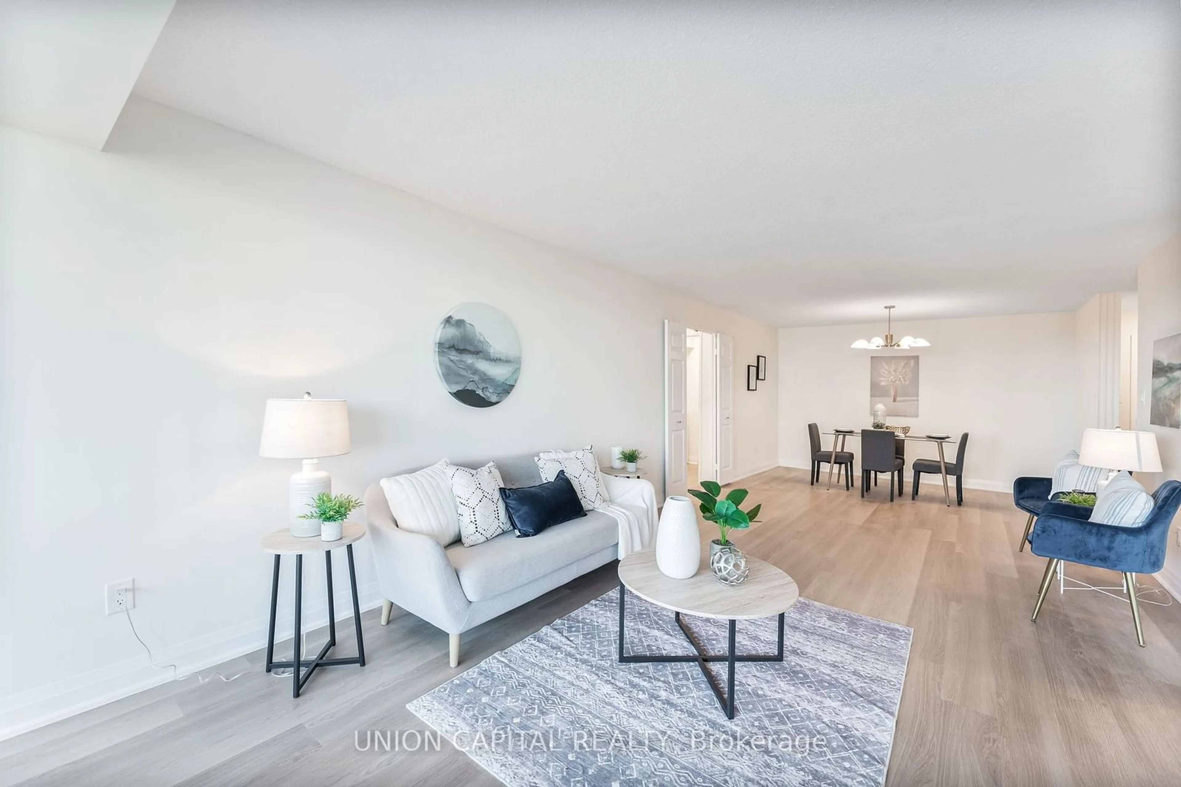 Living room with furniture, wood/laminate floor for 2350 Bridletowne Circ #611, Toronto Ontario M1W 3E6