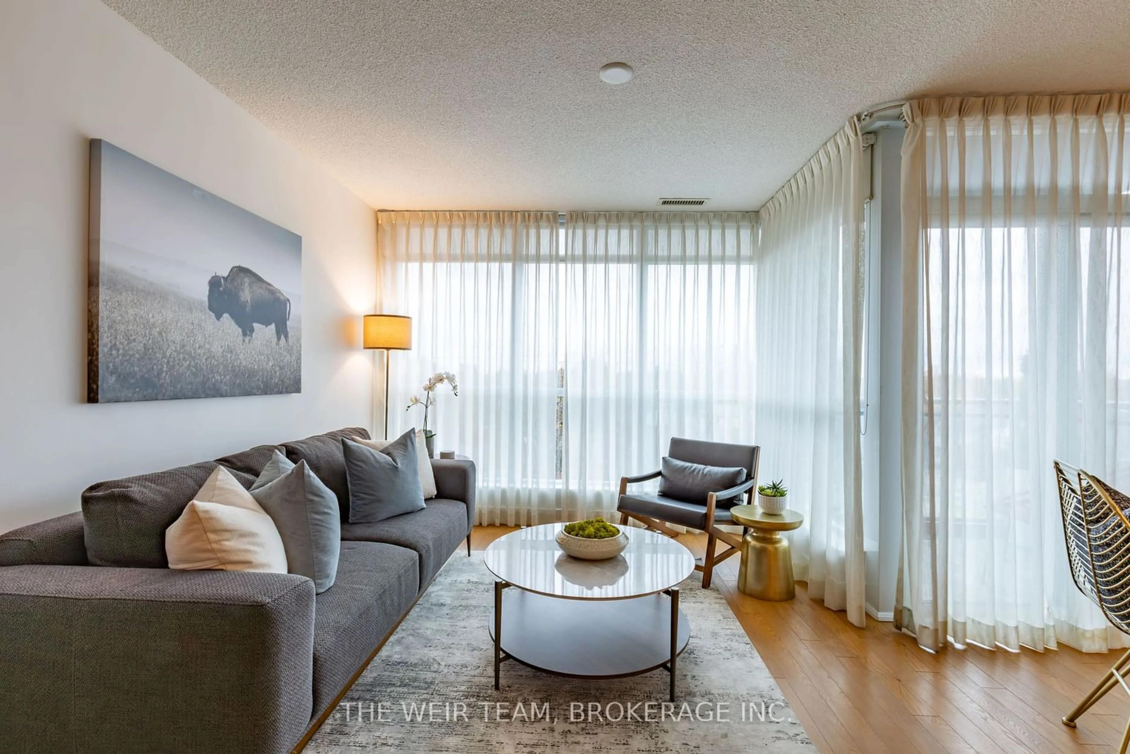 Living room with furniture, wood/laminate floor for 1048 Broadview Ave #505, Toronto Ontario M4K 2B8