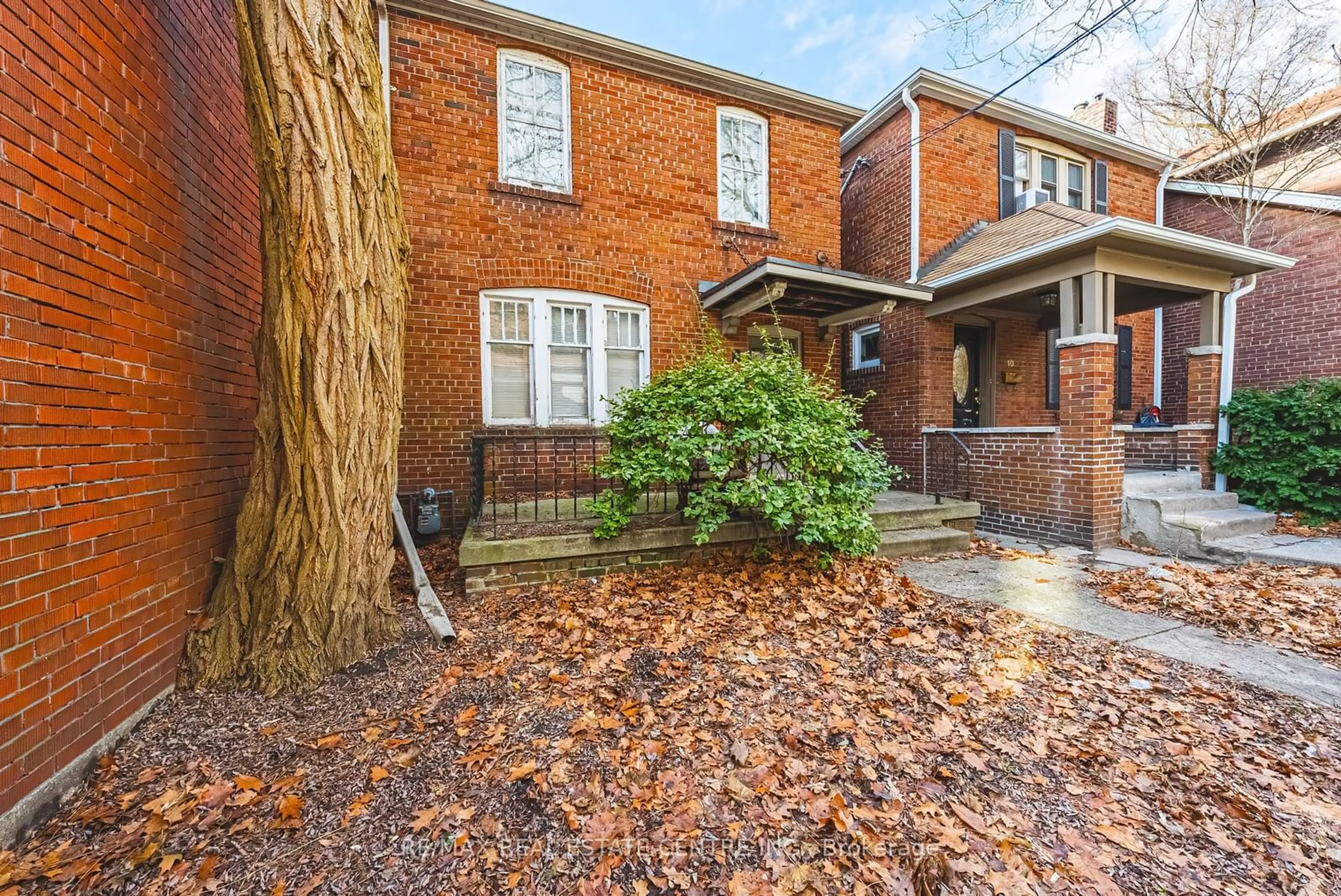 Home with brick exterior material, street for 8 MAIN St, Toronto Ontario M4E 2V4