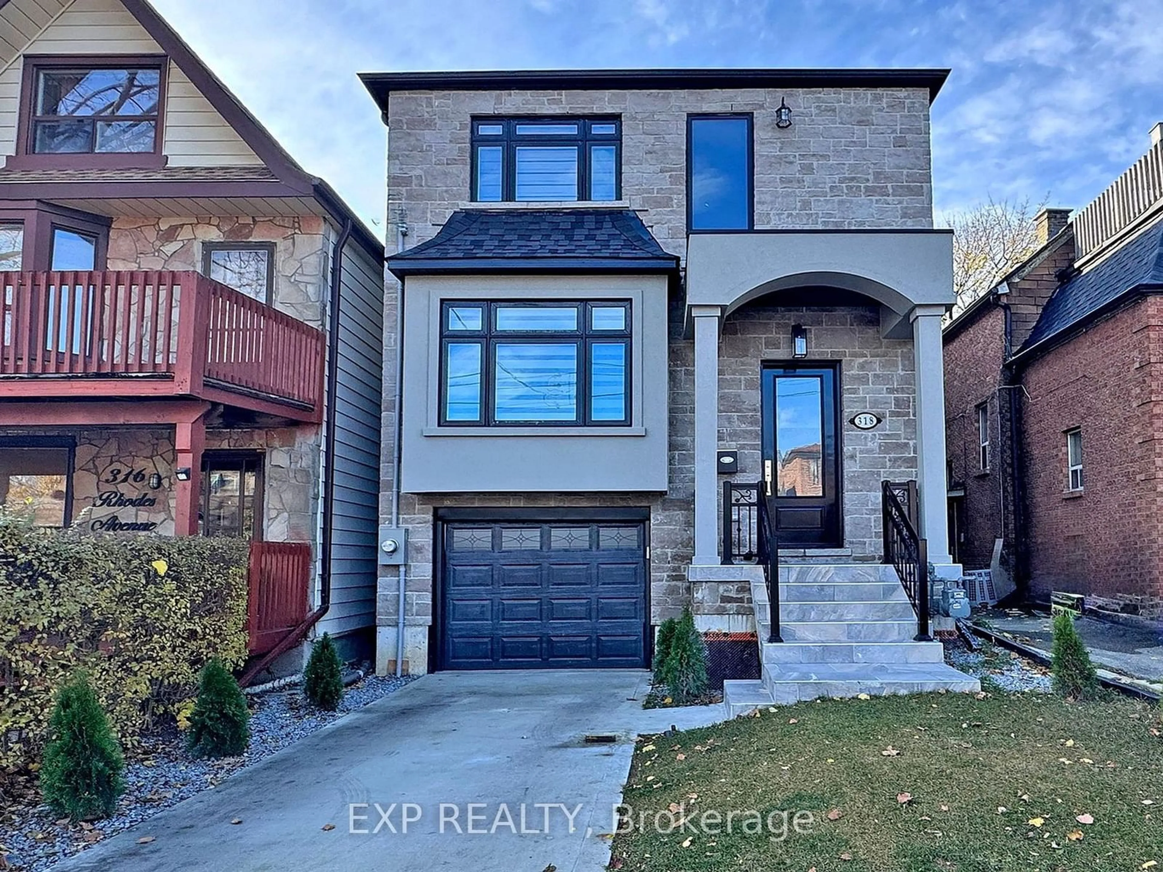 Home with brick exterior material, street for 318 Rhodes Ave, Toronto Ontario M4L 3A3