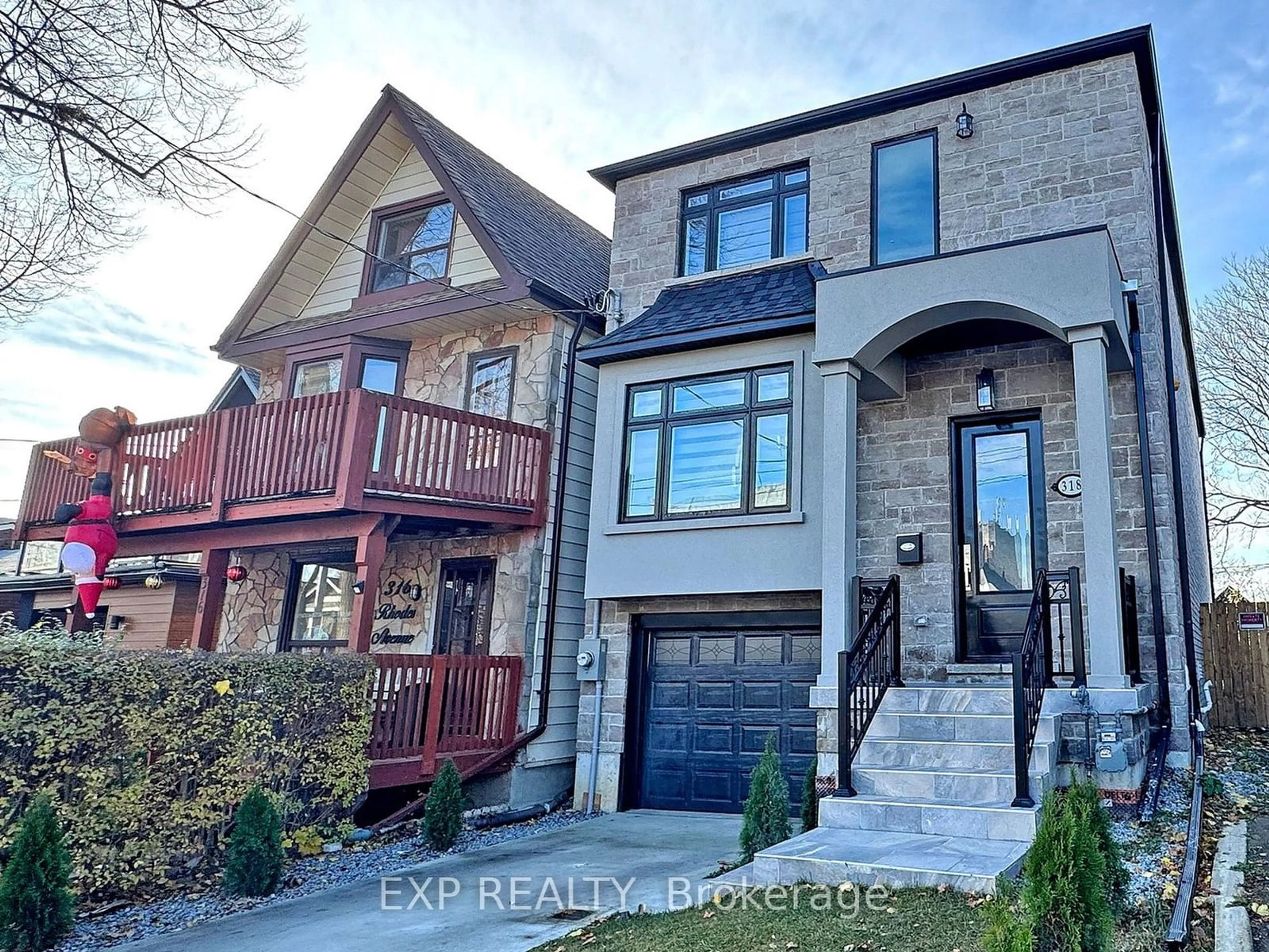 Home with brick exterior material, street for 318 Rhodes Ave, Toronto Ontario M4L 3A3