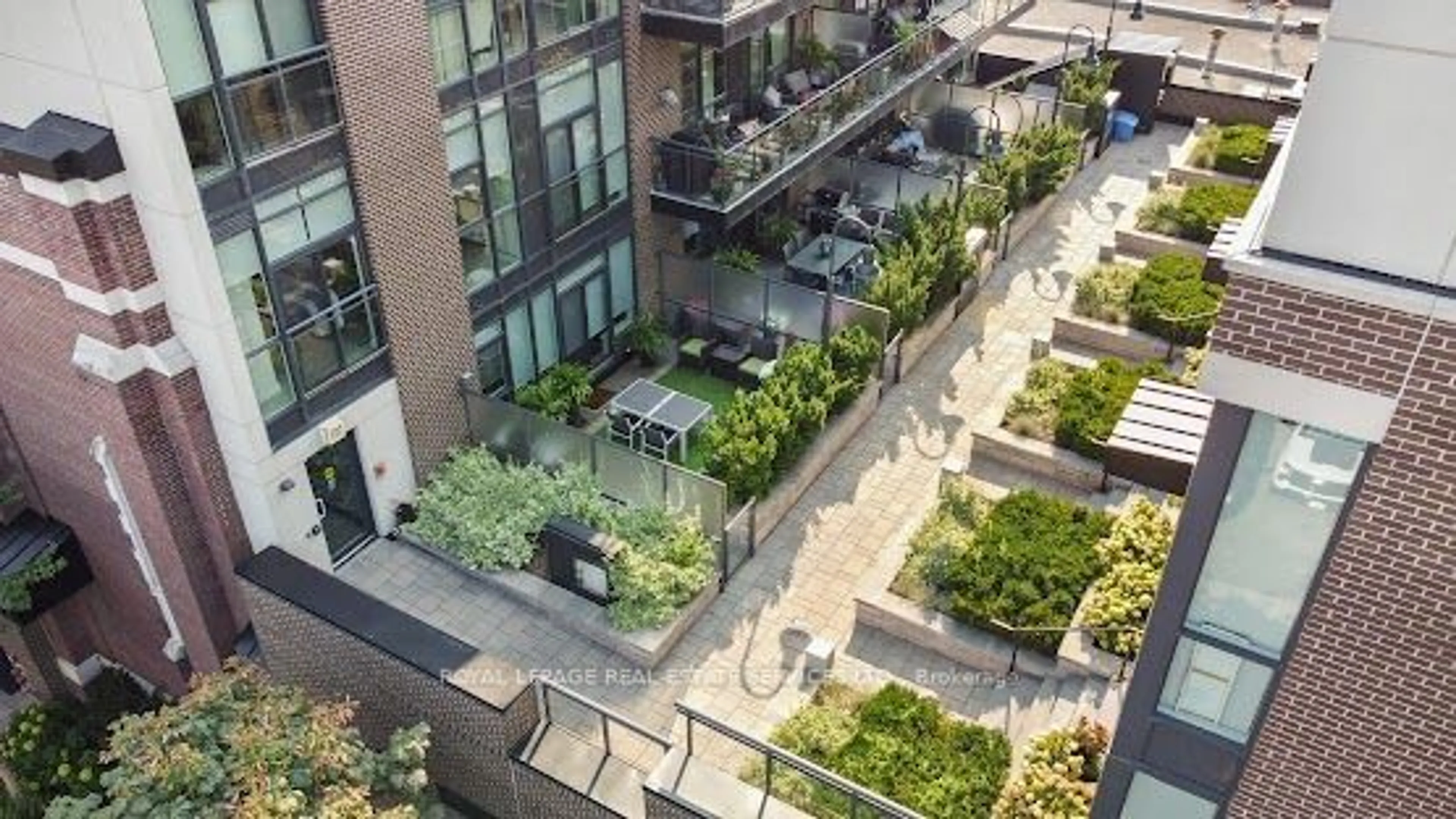 Patio, city buildings view from balcony for 2 Bellefair Ave #208, Toronto Ontario M4L 3T8