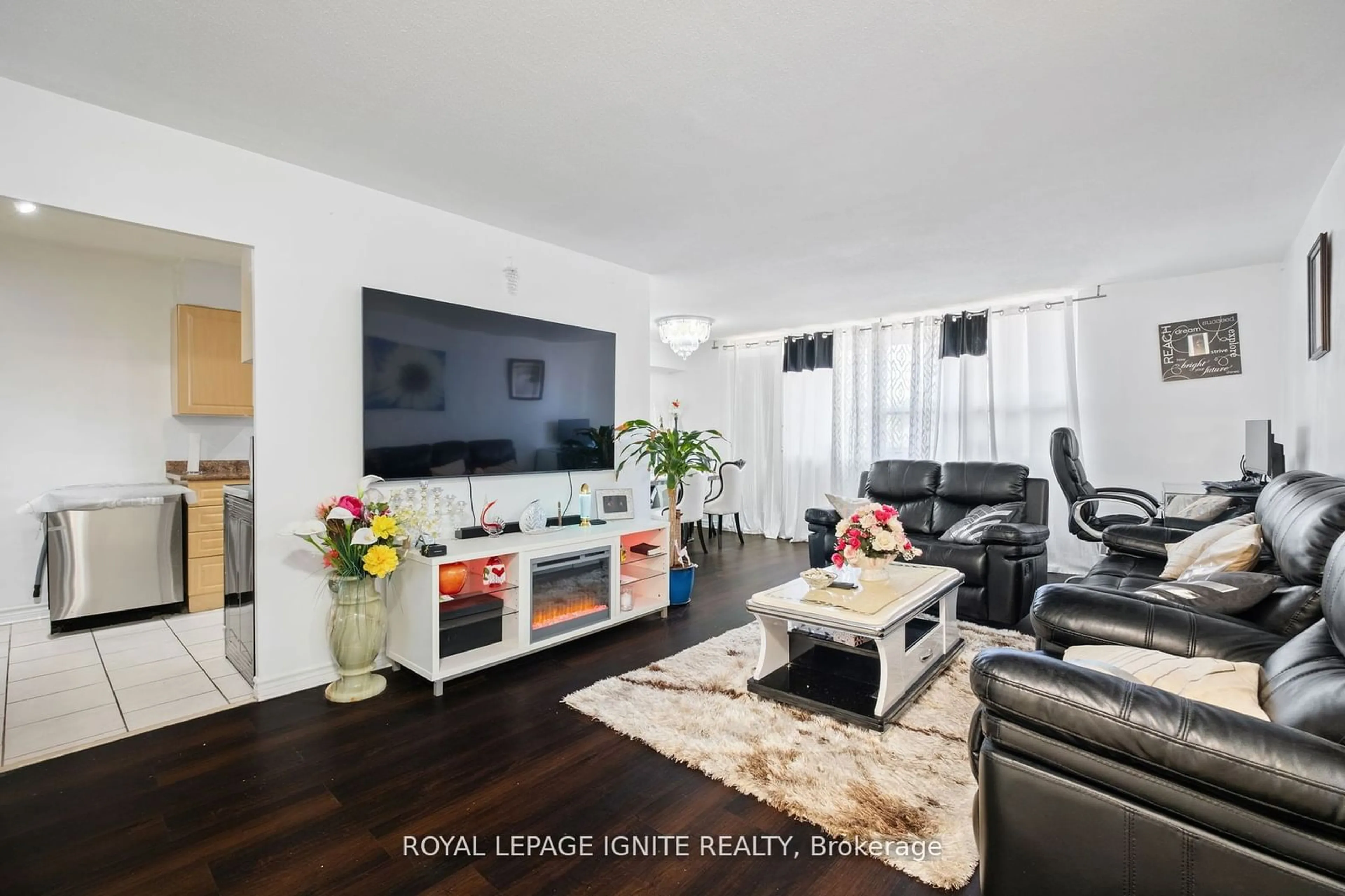 Living room with furniture, wood/laminate floor for 180 Markham Rd #201, Toronto Ontario M1M 2Z9