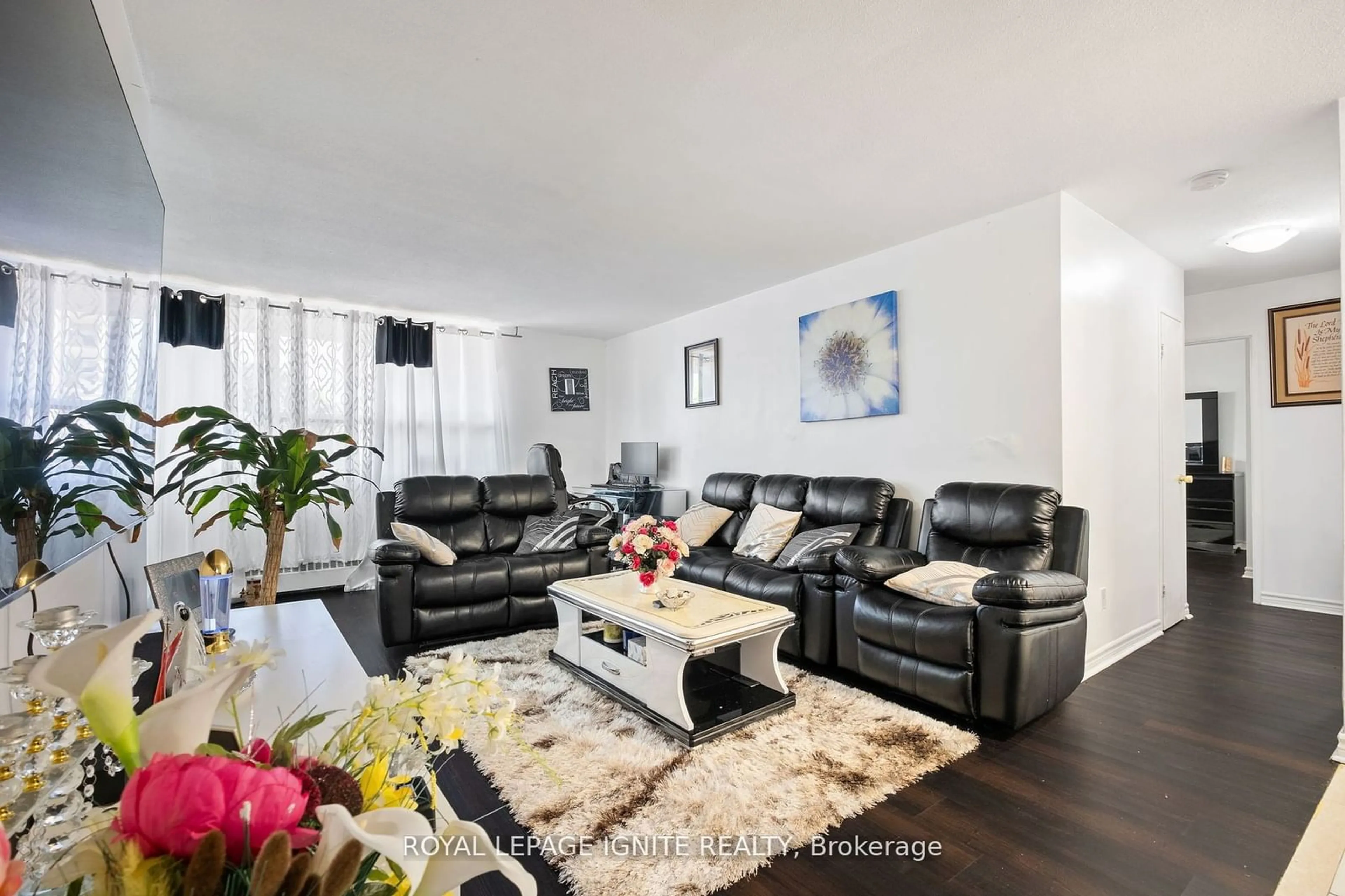 Living room with furniture, wood/laminate floor for 180 Markham Rd #201, Toronto Ontario M1M 2Z9