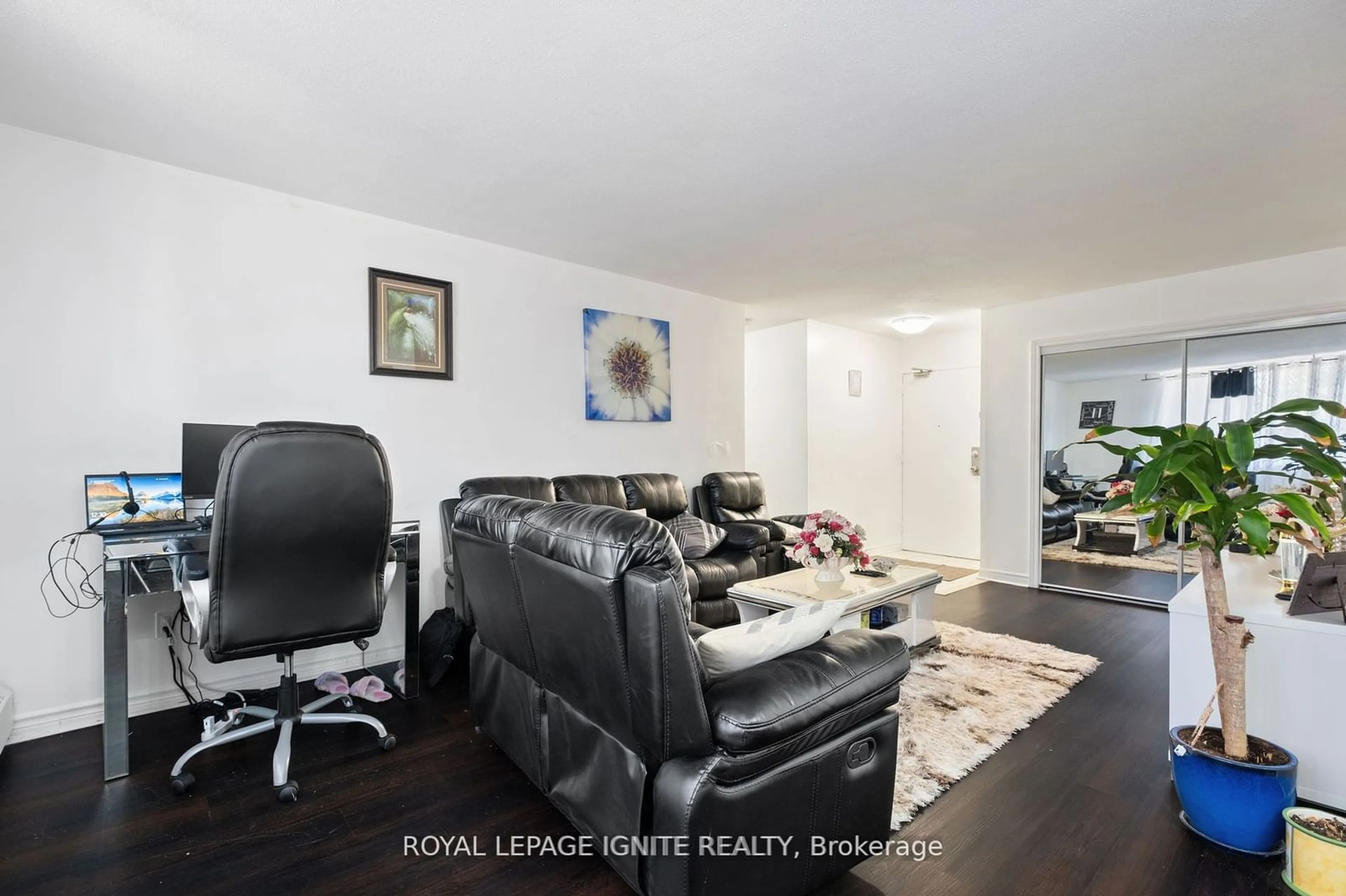 Living room with furniture, wood/laminate floor for 180 Markham Rd #201, Toronto Ontario M1M 2Z9